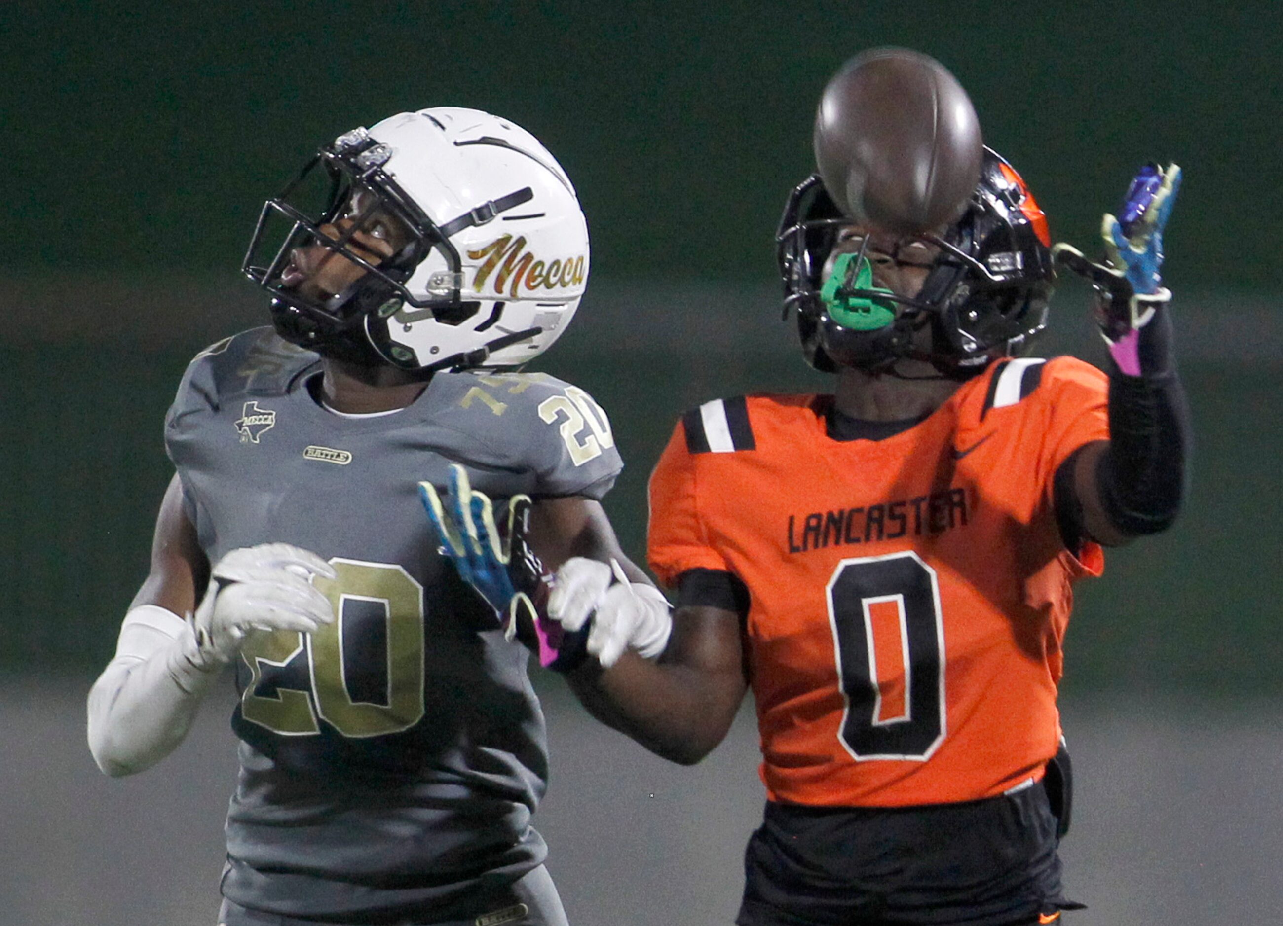 Lancaster receiver Ti'Erick Martin(0) is unable to pull in a long pass as he is defended by...