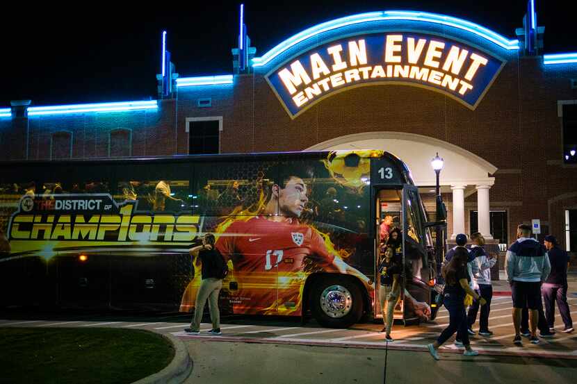 El Paso Eastwood football team buses arrive at the Main Event entertainment center for a...