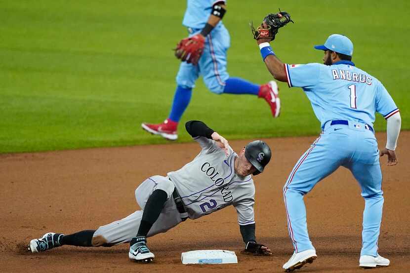 Colorado Rockies shortstop Trevor Story is out at second base on a stolen base attempt after...