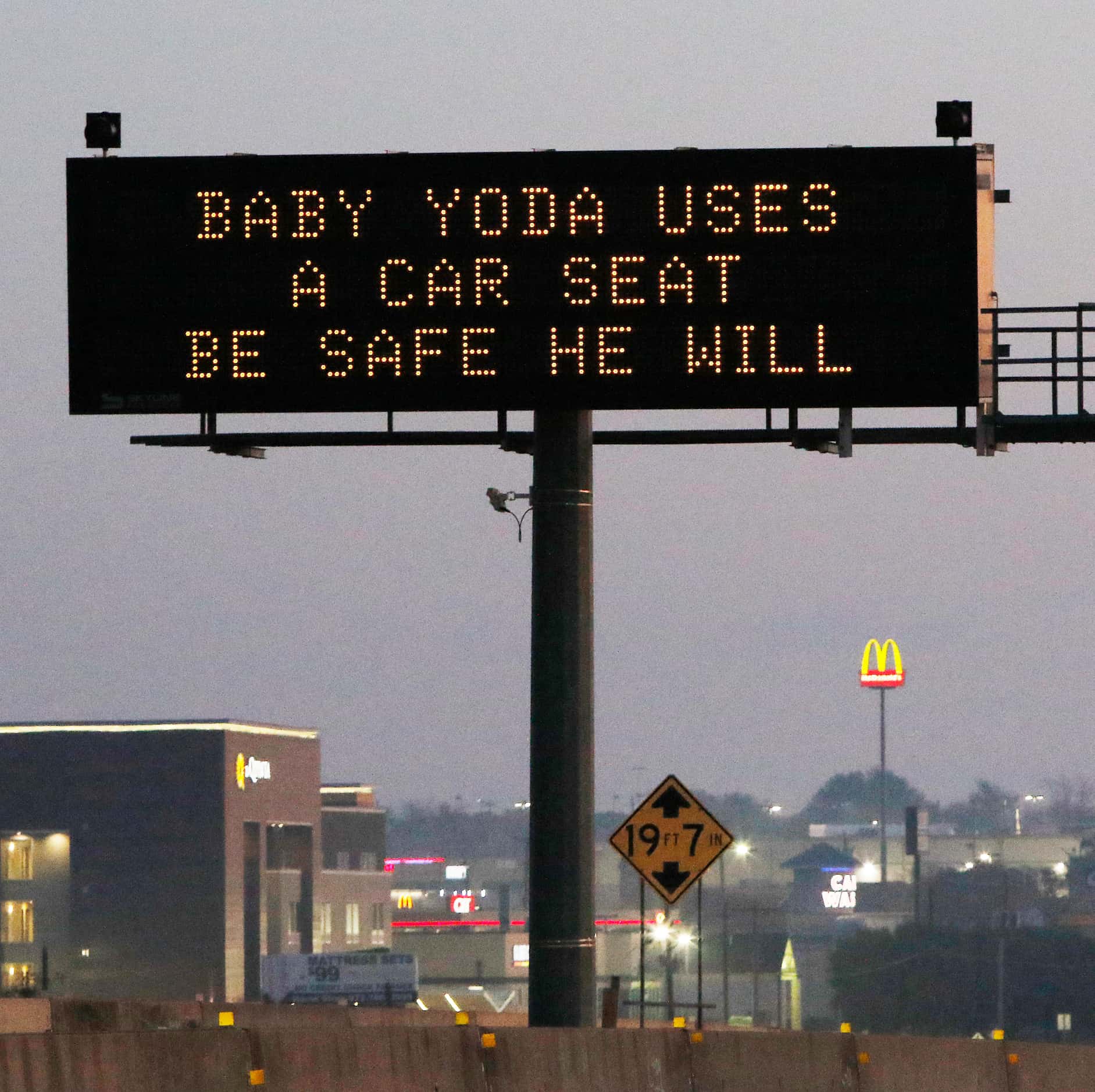 TXDOT's Safe Driver sign" BABY YODA USES A CAR SEAT BE SAFE HE WILL" on Highway 67 in Dallas...