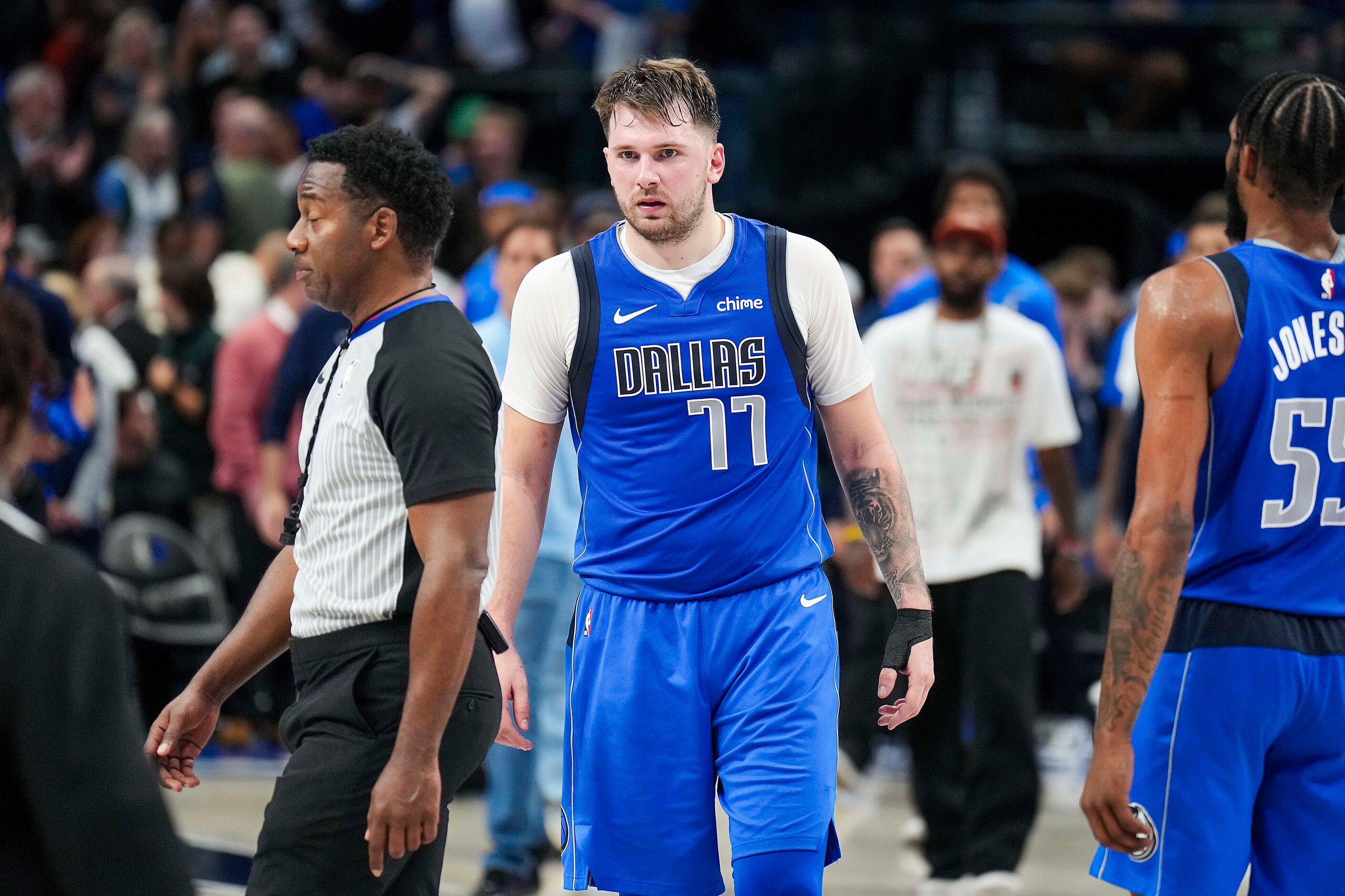 Dallas Mavericks guard Luka Doncic stares at referee Mitchell Ervin after a 126-120 loss to...