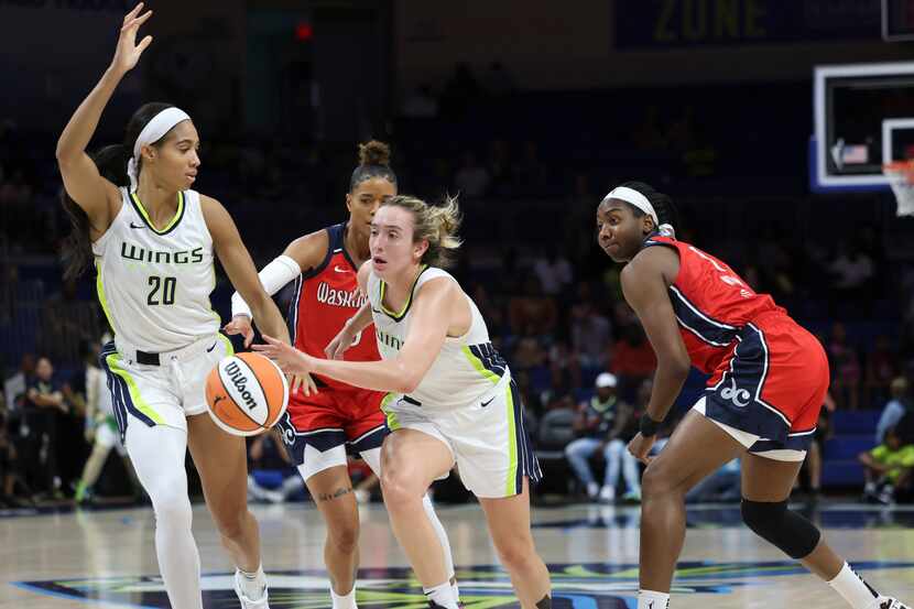 Dallas Wings forward Isabelle Harrison (20) makes a path for Dallas Wings guard Marina...