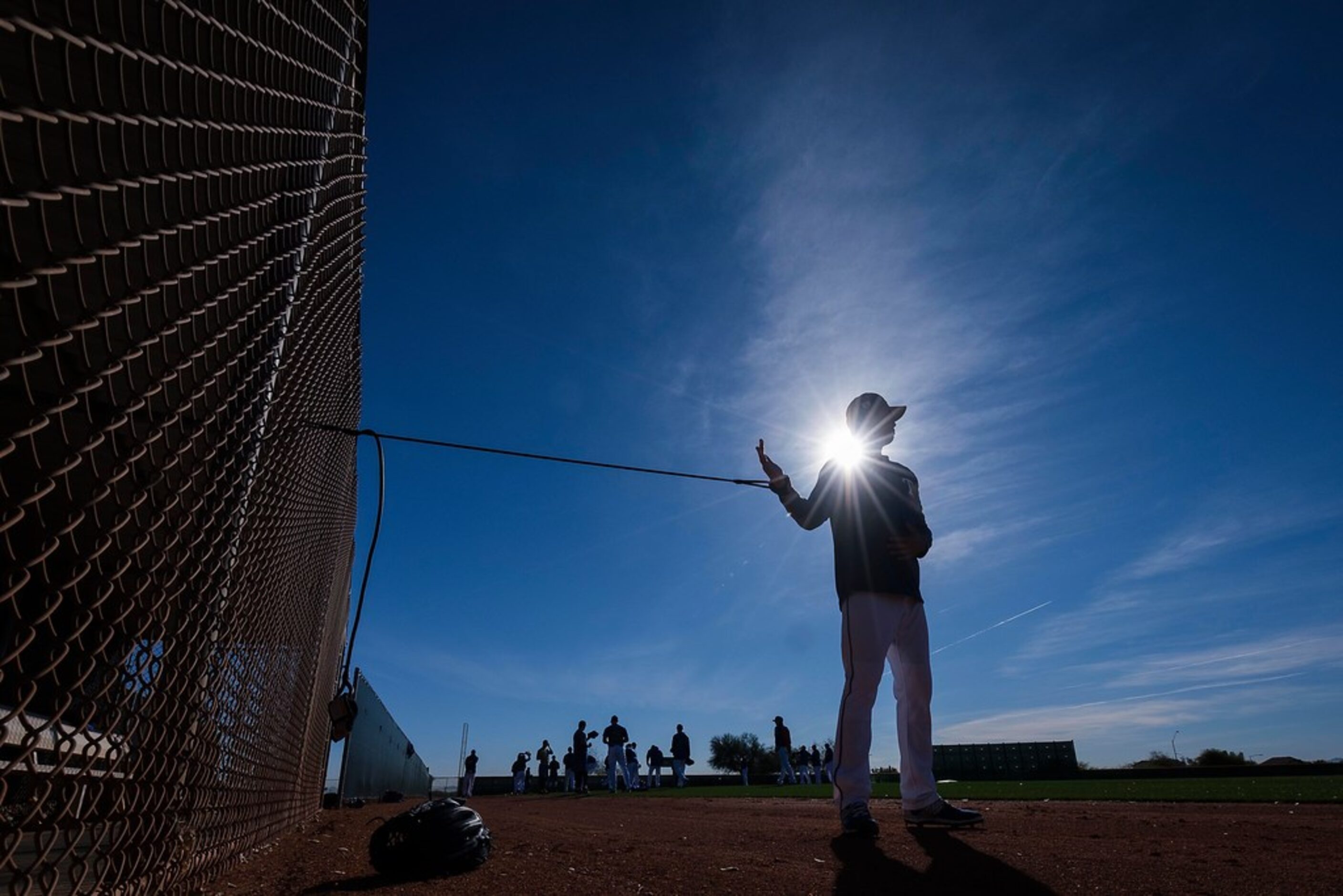 Texas Rangers pitcher Wei-Chieh Huang stretches after pitchers and catchers reported for...