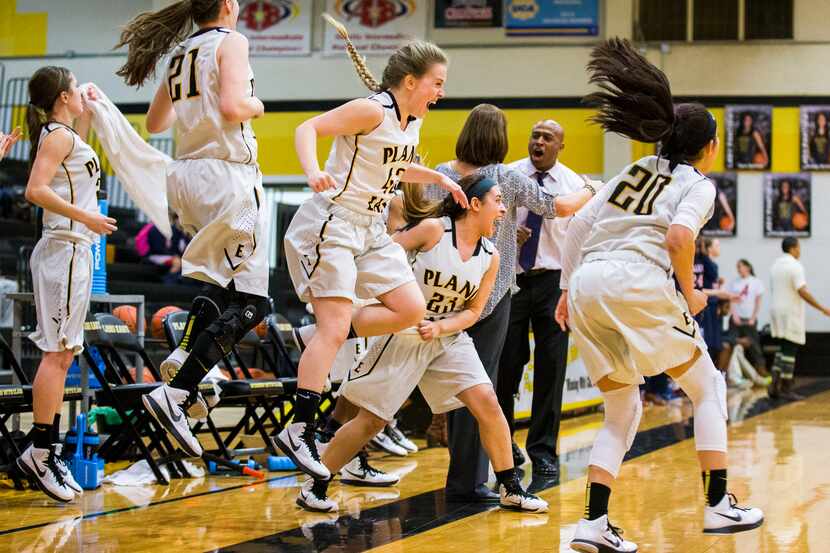 Plano East players celebrate a win over Allen after their high school District 6-6A girls...