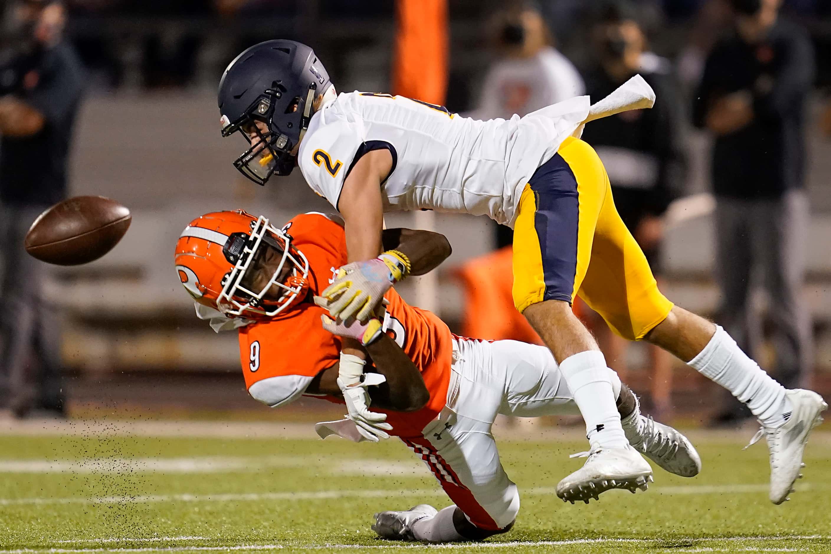 Rockwall defensive back Dariel Brown (9) breaks up a pass intended for Highland Park wide...