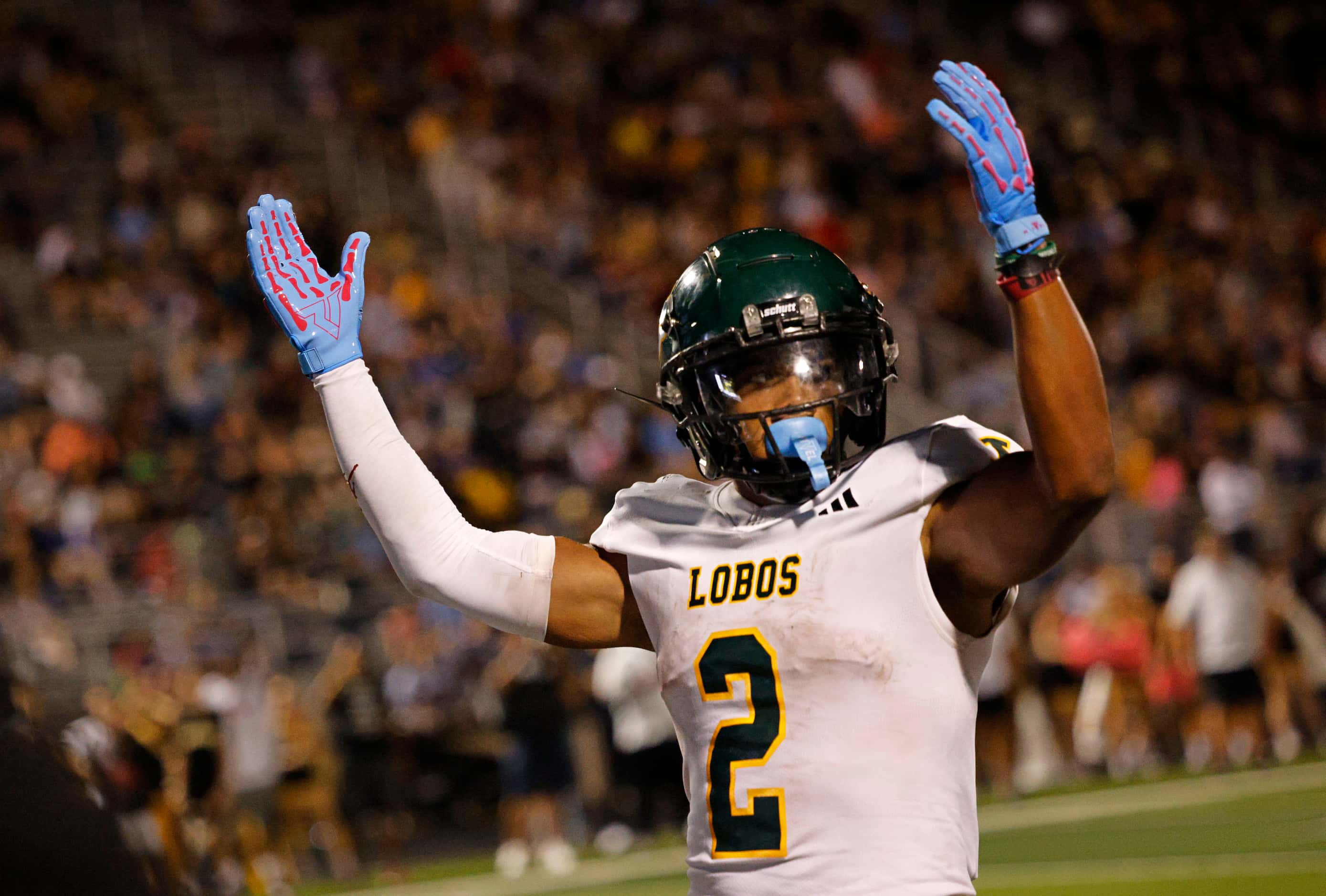 Longview's Taylor Tatum (2) reacts after he scored a touchdown over Forney during the first...