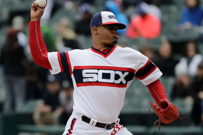 Chicago White Sox starting pitcher Reynaldo Lopez throws against the Texas Rangers during...