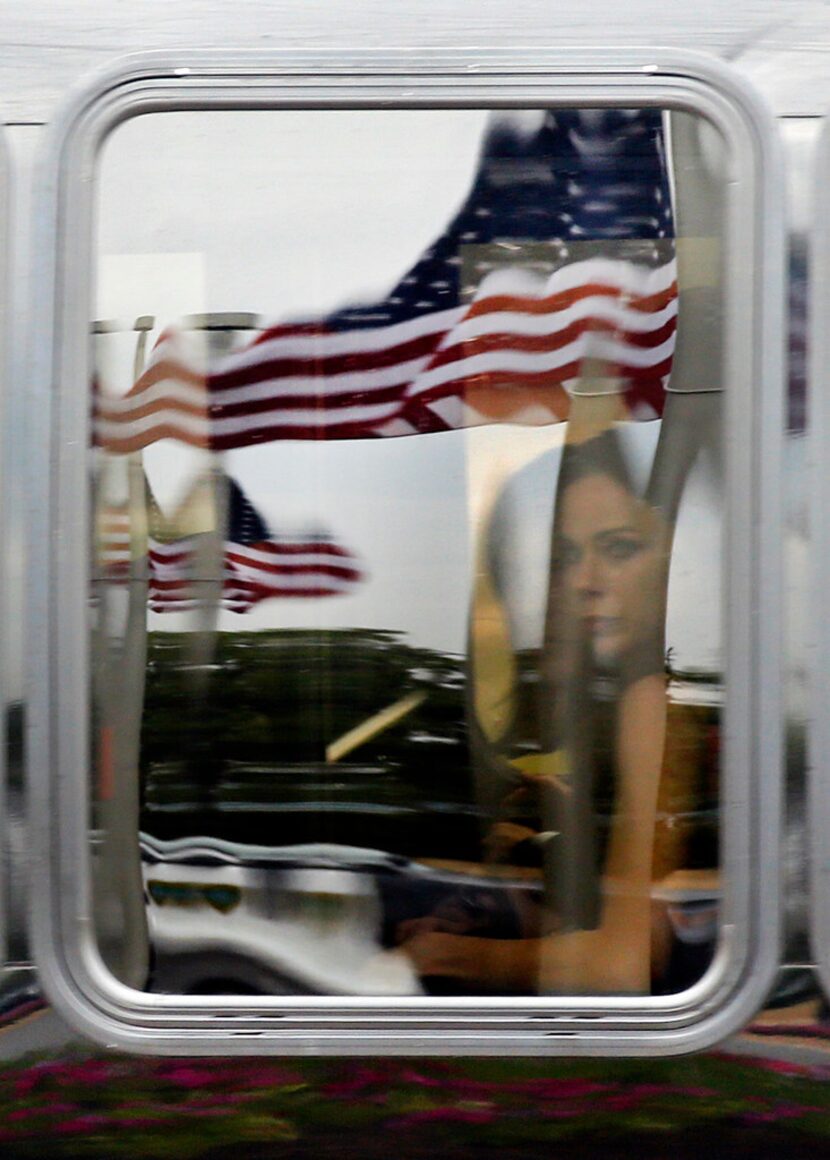 A processional bus passed the George H.W. Bush Presidential Library and Museum on Saturday...