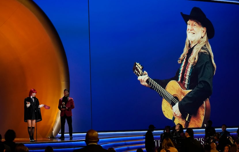 Shania Twain accepts the award for best country album on behalf of Willie Nelson for "A...