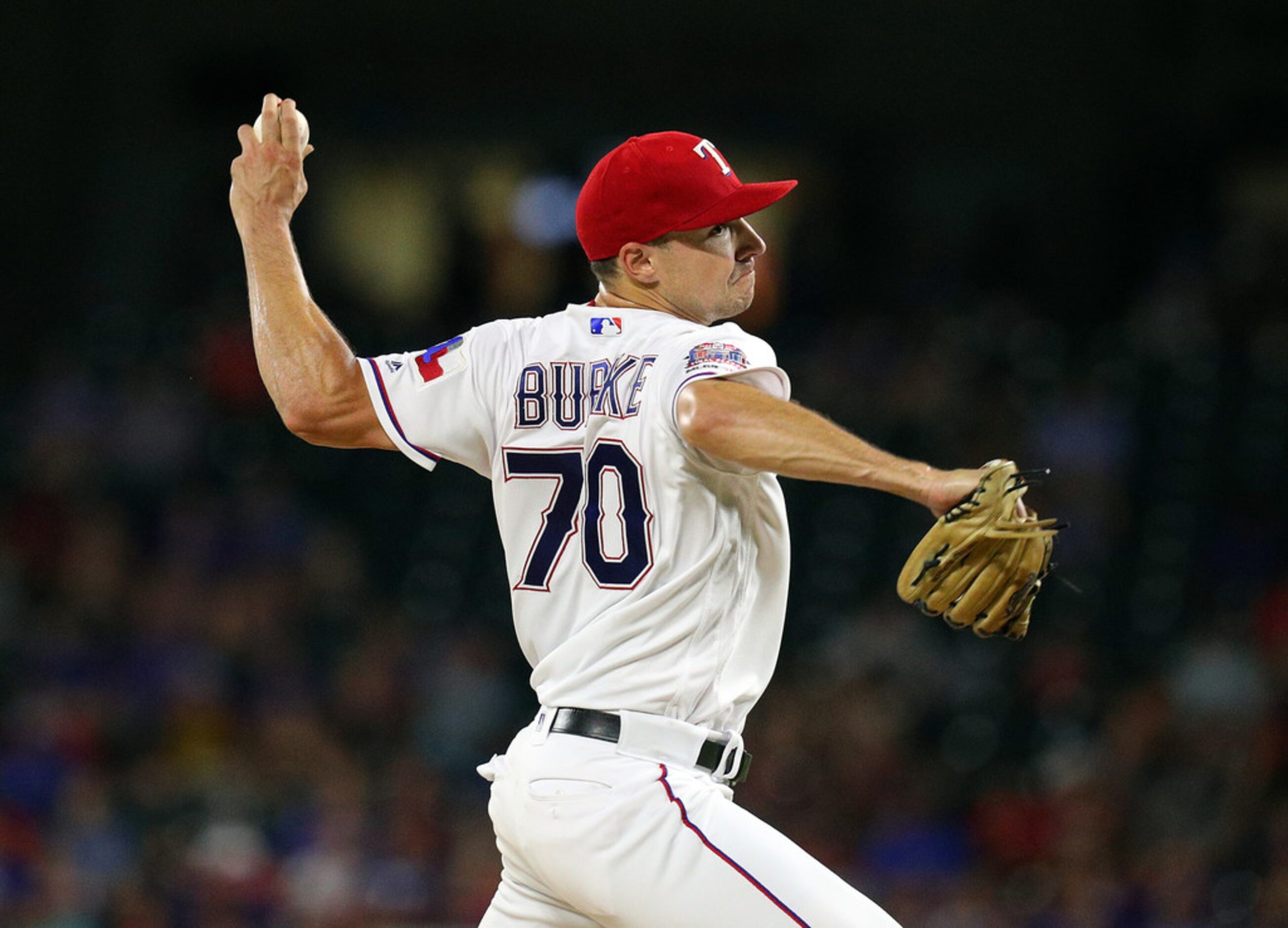 ARLINGTON, TEXAS - SEPTEMBER 13: Brock Burke #70 of the Texas Rangers pitches in the third...