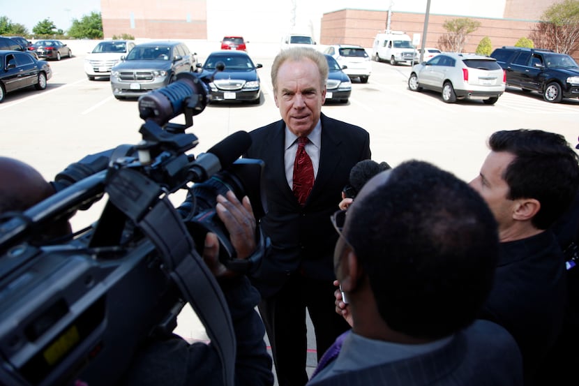 Former Dallas Cowboys player Roger Staubach talks with members of the press before entering...