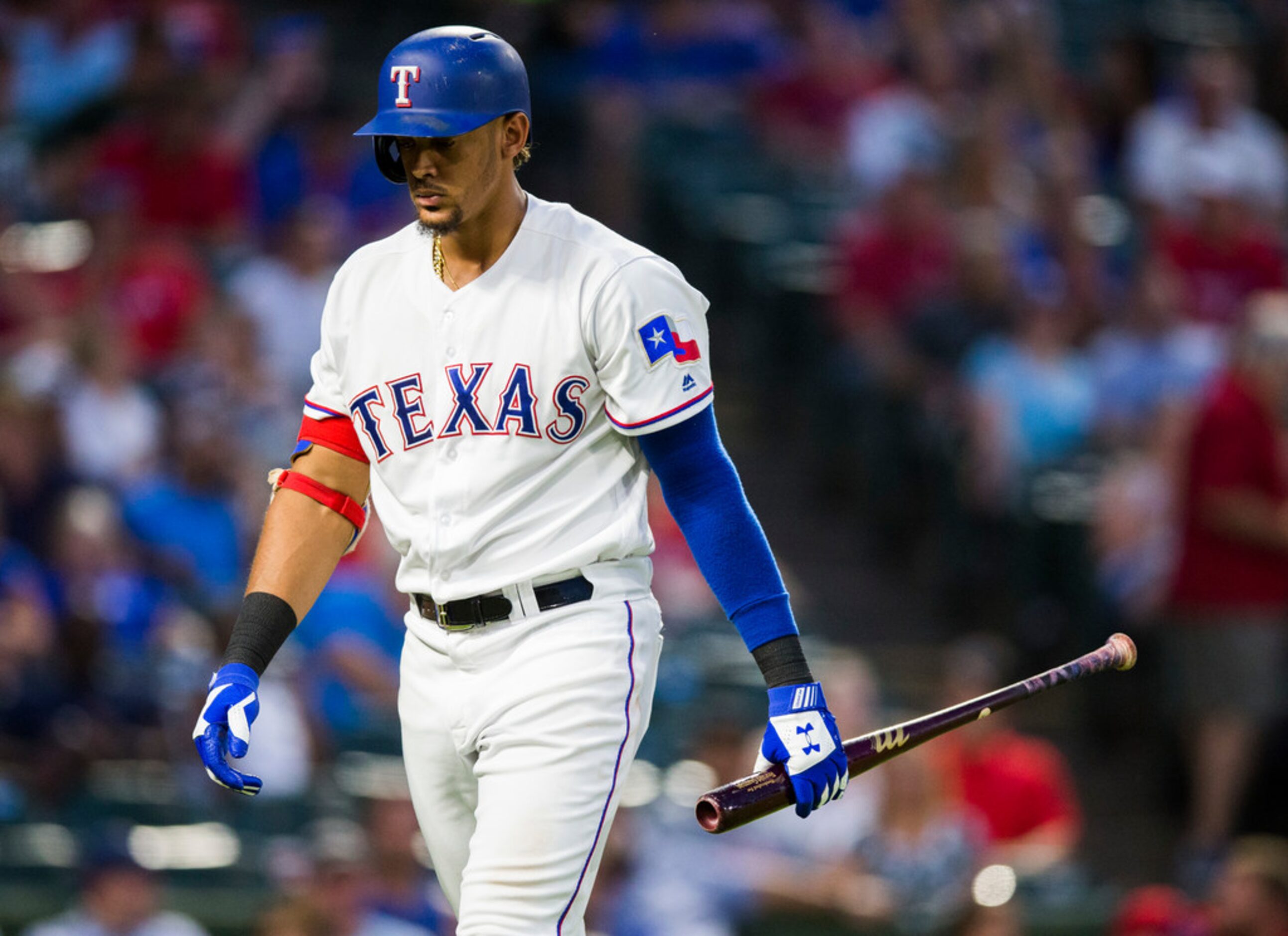 Texas Rangers first baseman Ronald Guzman (67) walks to the dugout after striking out in the...