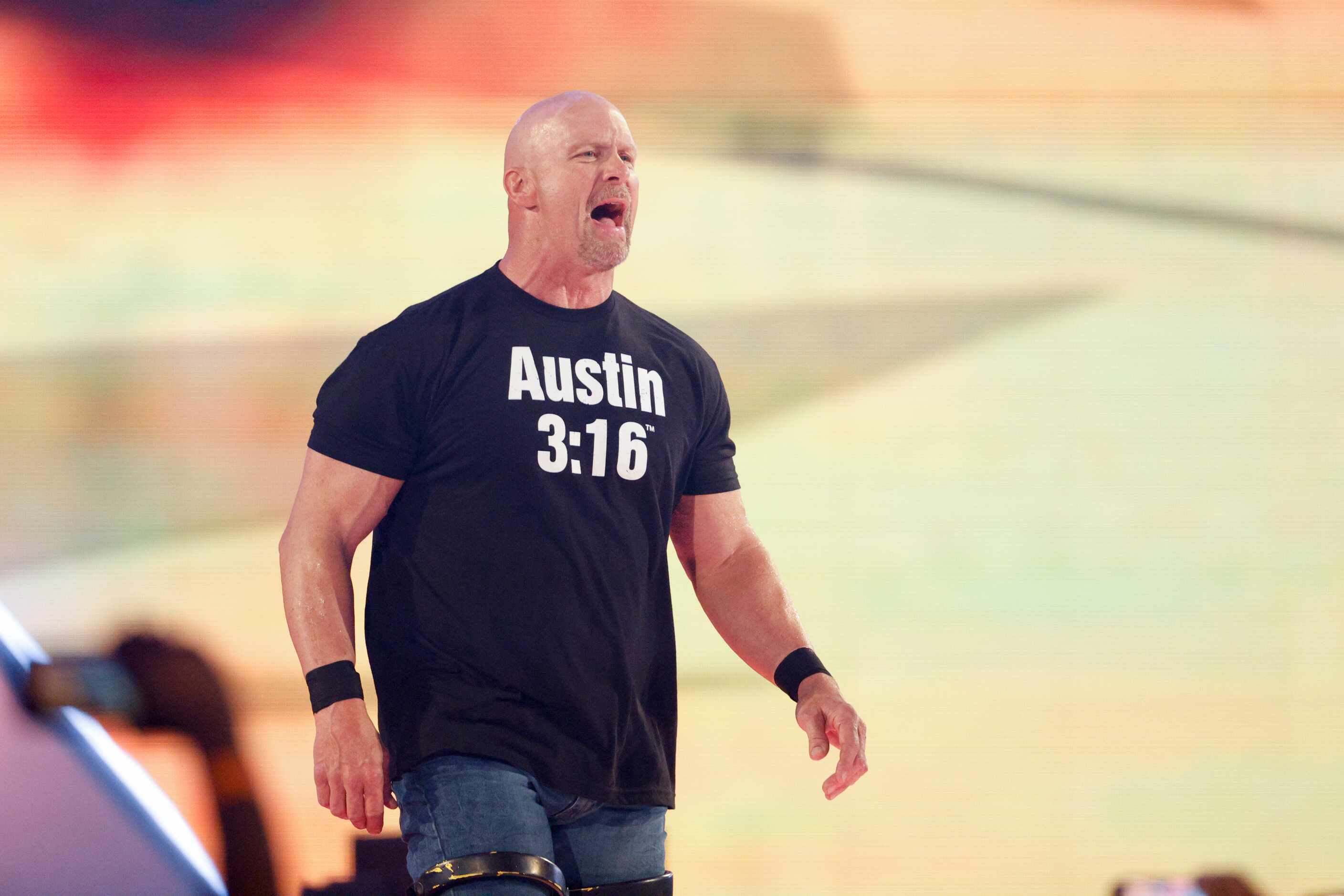 “Stone Cold” Steve Austin enters the ring before a match at WrestleMania Sunday at AT&T...