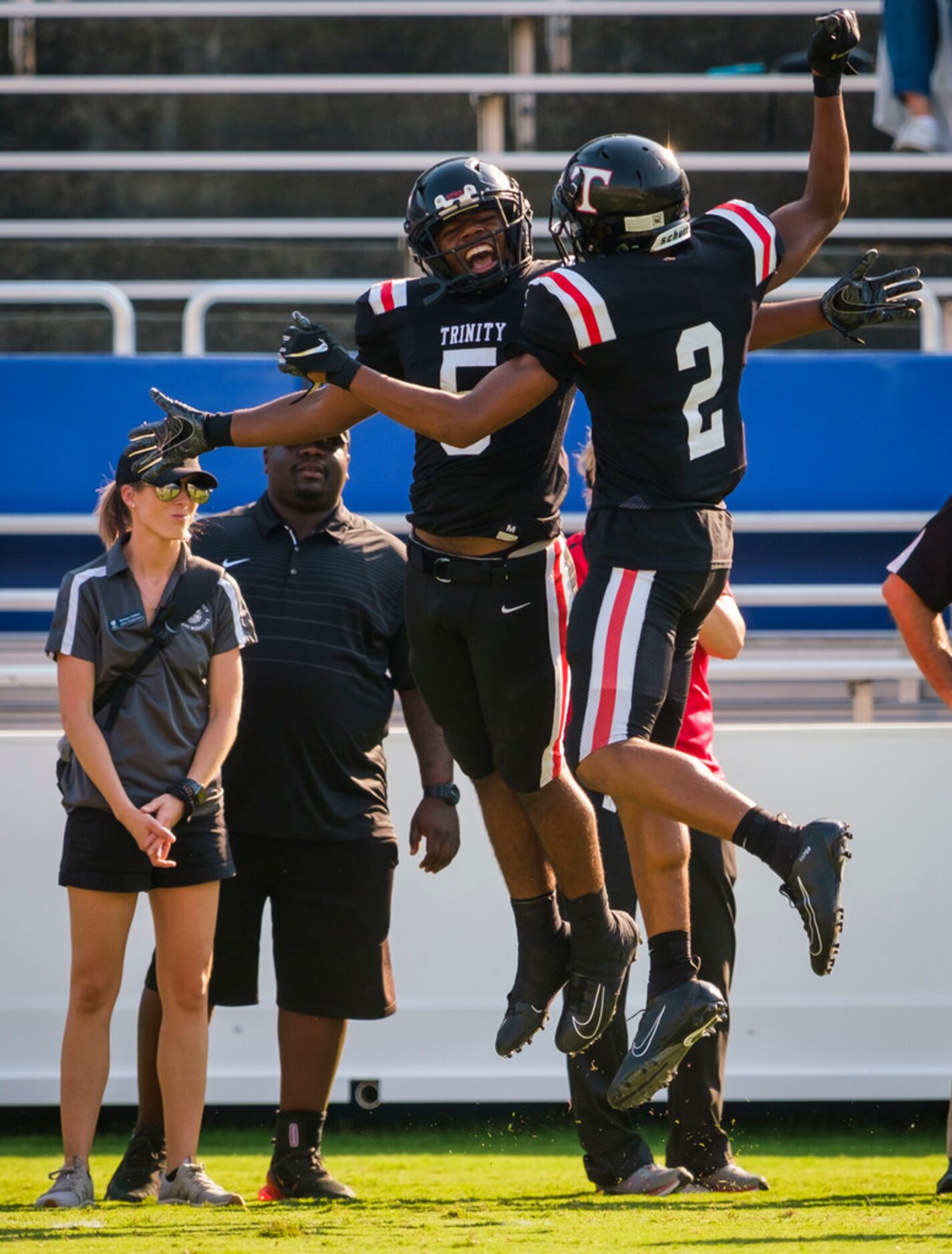 Euless Trinity running backs AJ Barnett (5) celebrates with Ollie Gordon (2) celebrate a...