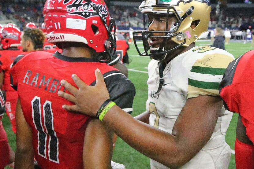 Cedar Hill receiver Charleston Rambo (11) gets some comforting words from DeSoto quarterback...