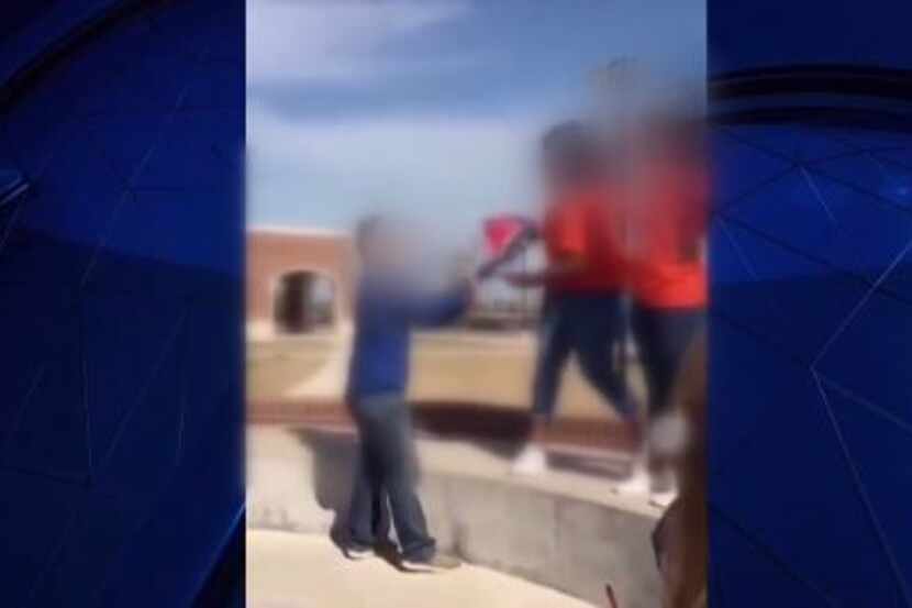 Students tussled over a Confederate flag at Eaton High School on Tuesday. Their faces have...