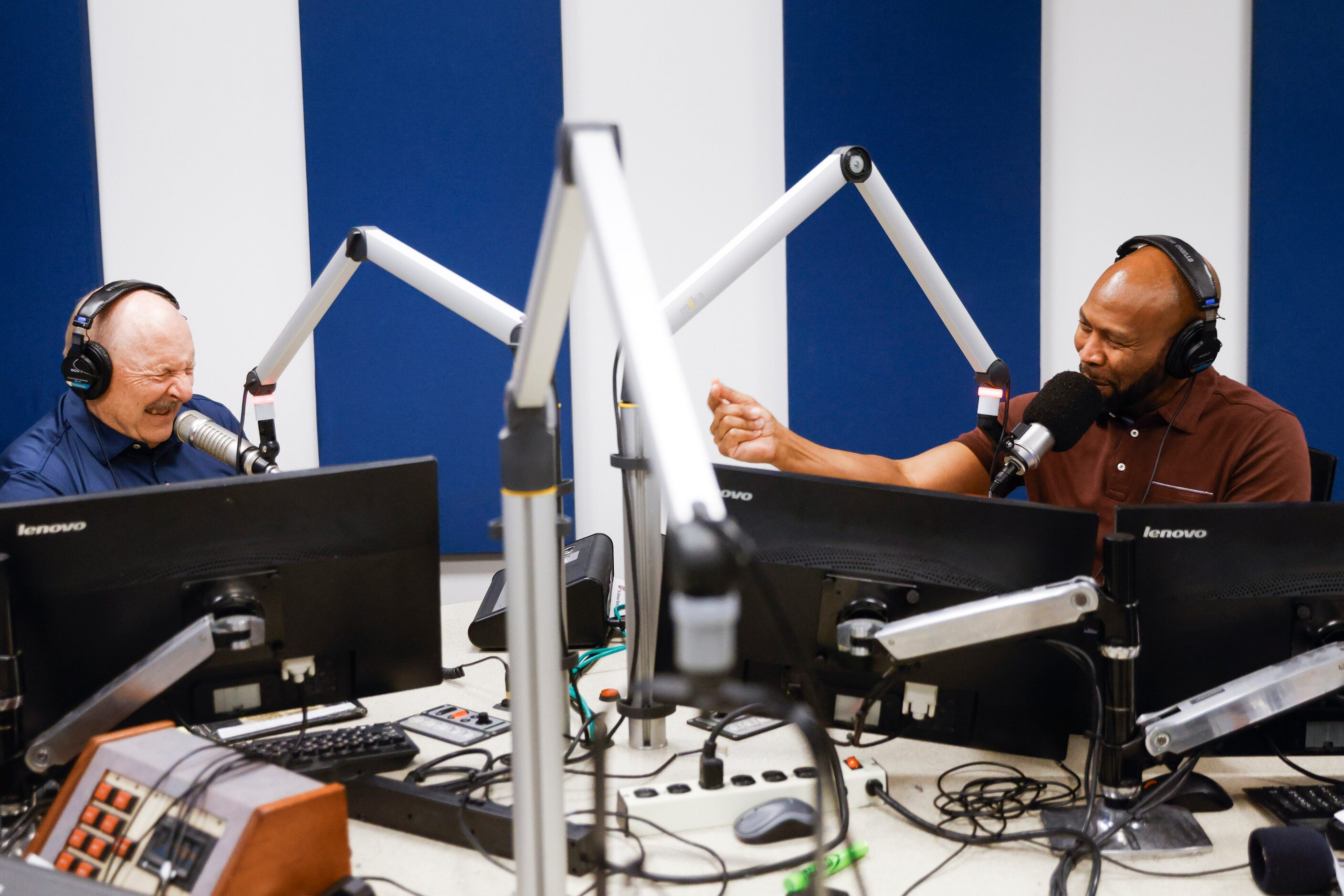 Local sports radio legend Norm Hitzges (left) reacts towards his co-host Donovan Lewis...