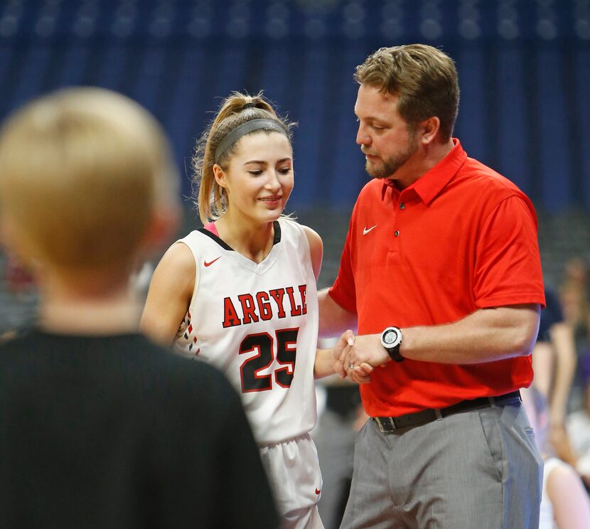 Argyle head coach Chance Westmoreland congratulates Argyle's Sydney Standifer in closing...