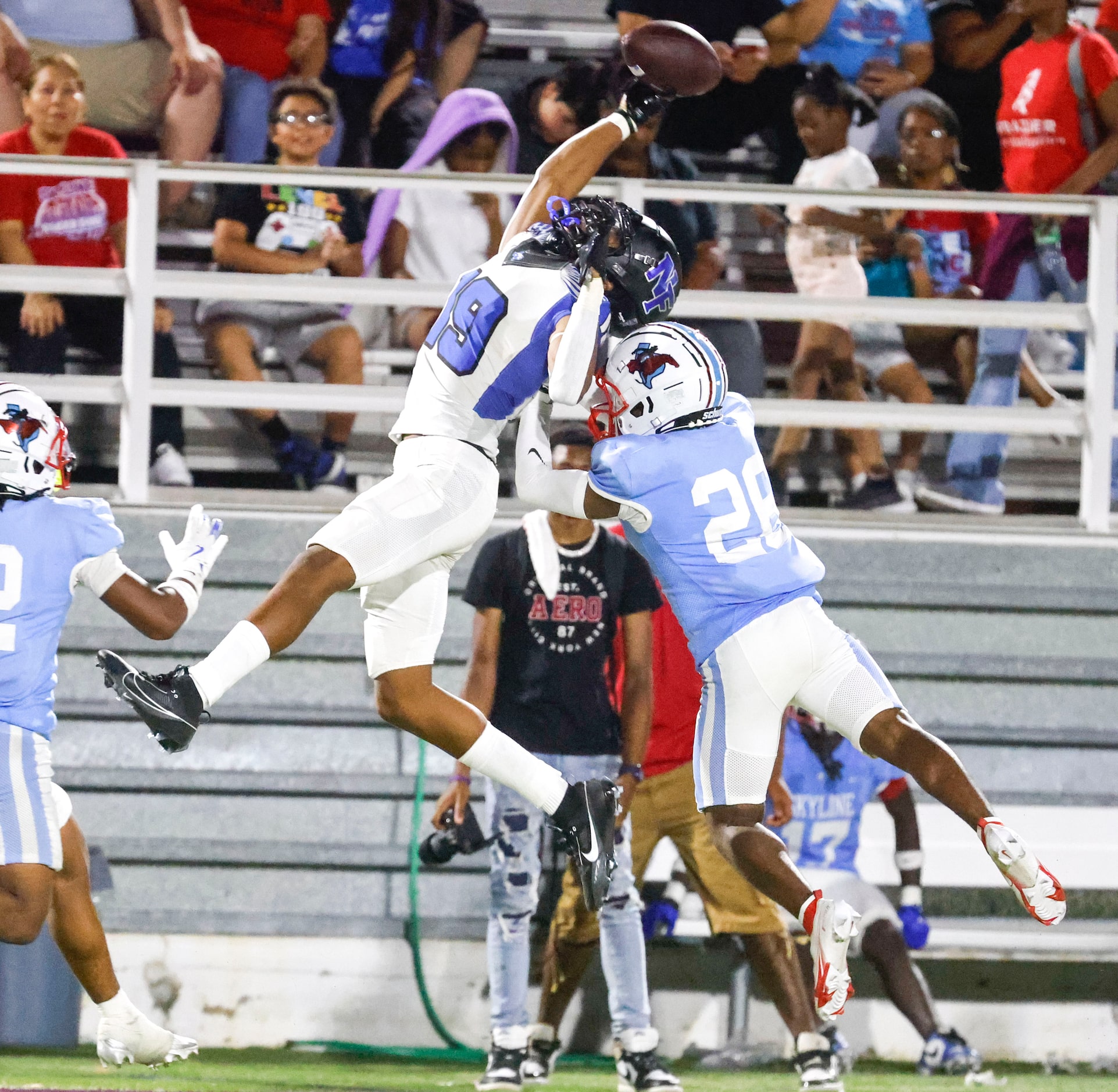 North Forney High’s Briceson Thrower (19) successfully catches a throw past Skyline High’s...