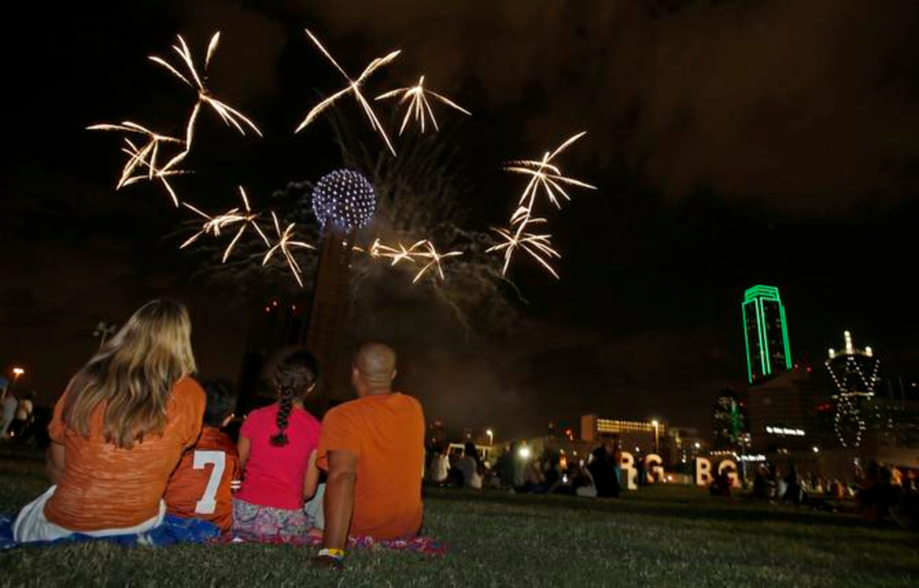 
Amanda, Brodie, Caitlyn and Eric Clemons of Austin sit mesmerized as Reunion Tower puts on...