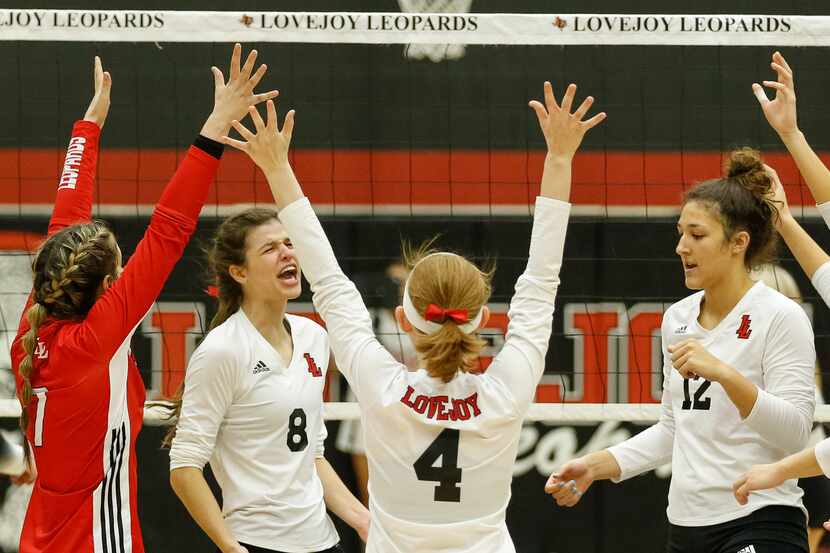 Lovejoy outside hitter Elizabeth Ponder (8) and middle blocker Hannah Gonzalez (12) react...