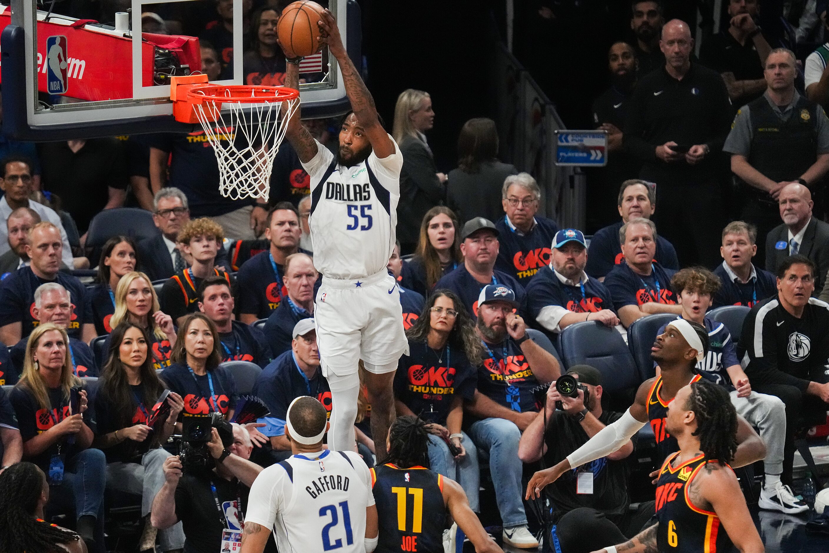 Dallas Mavericks forward Derrick Jones Jr. (55) dunks the ball past Oklahoma City Thunder...