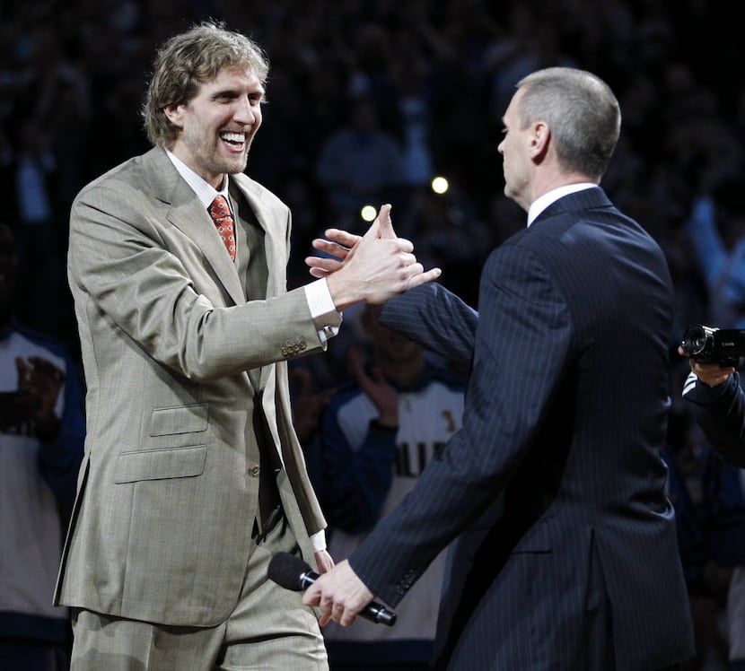 Dallas Mavericks power forward Dirk Nowitzki (41) greets Dallas Mavericks head coach Rick...