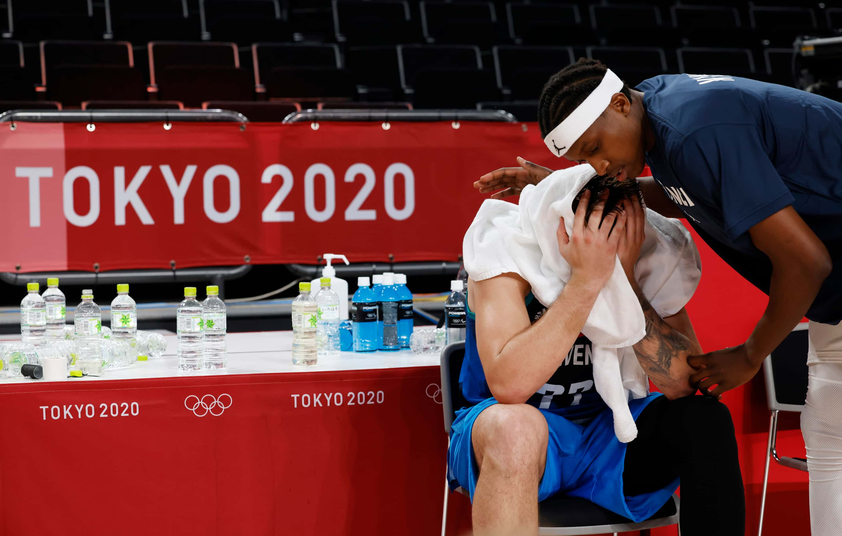 Slovenia’s Luka Doncic (77) sits dejected as France’s Frank Ntilikina (1) speaks to him...