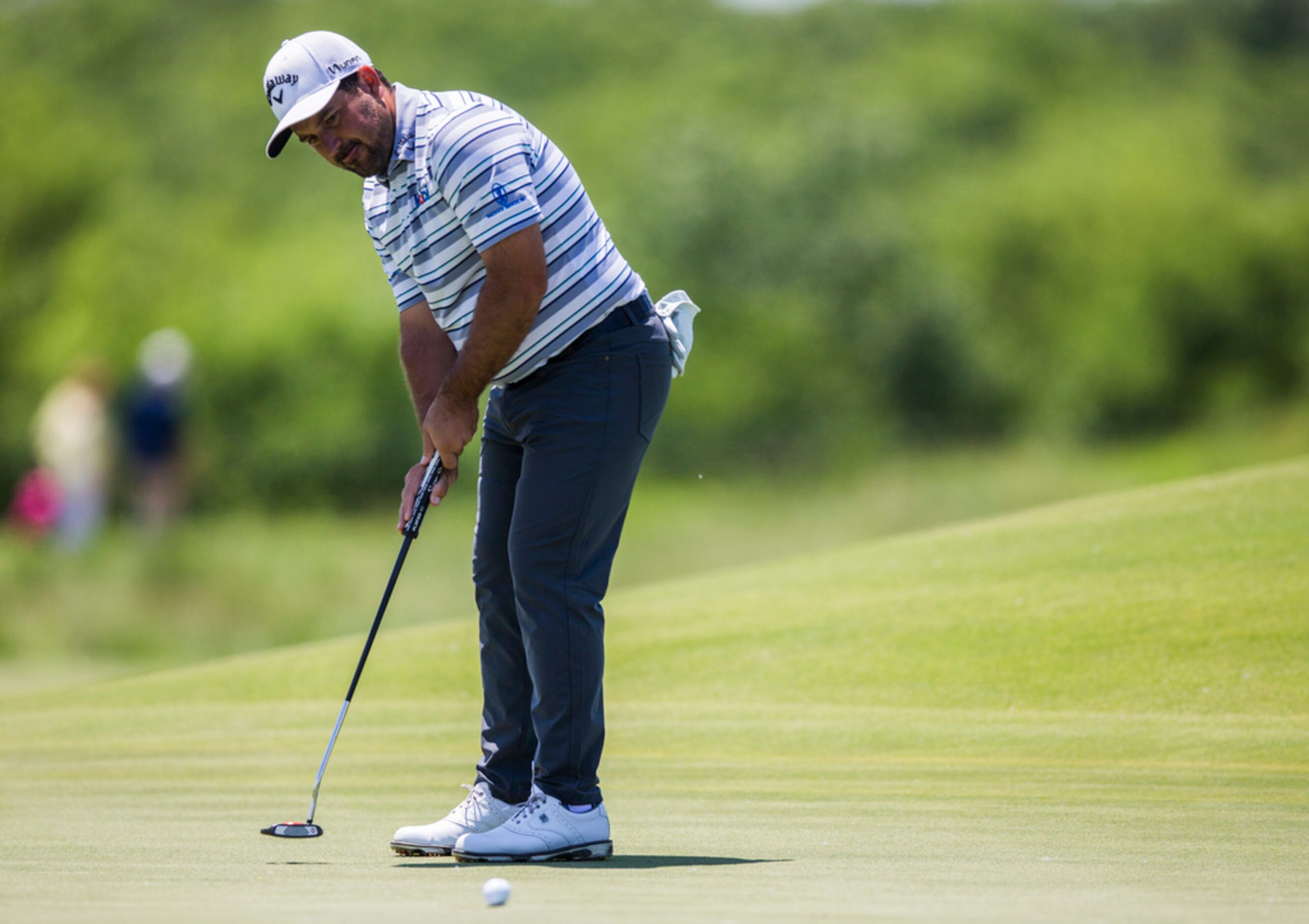 Roberto Diaz putts on the third green during round 4 of the AT&T Byron Nelson golf...