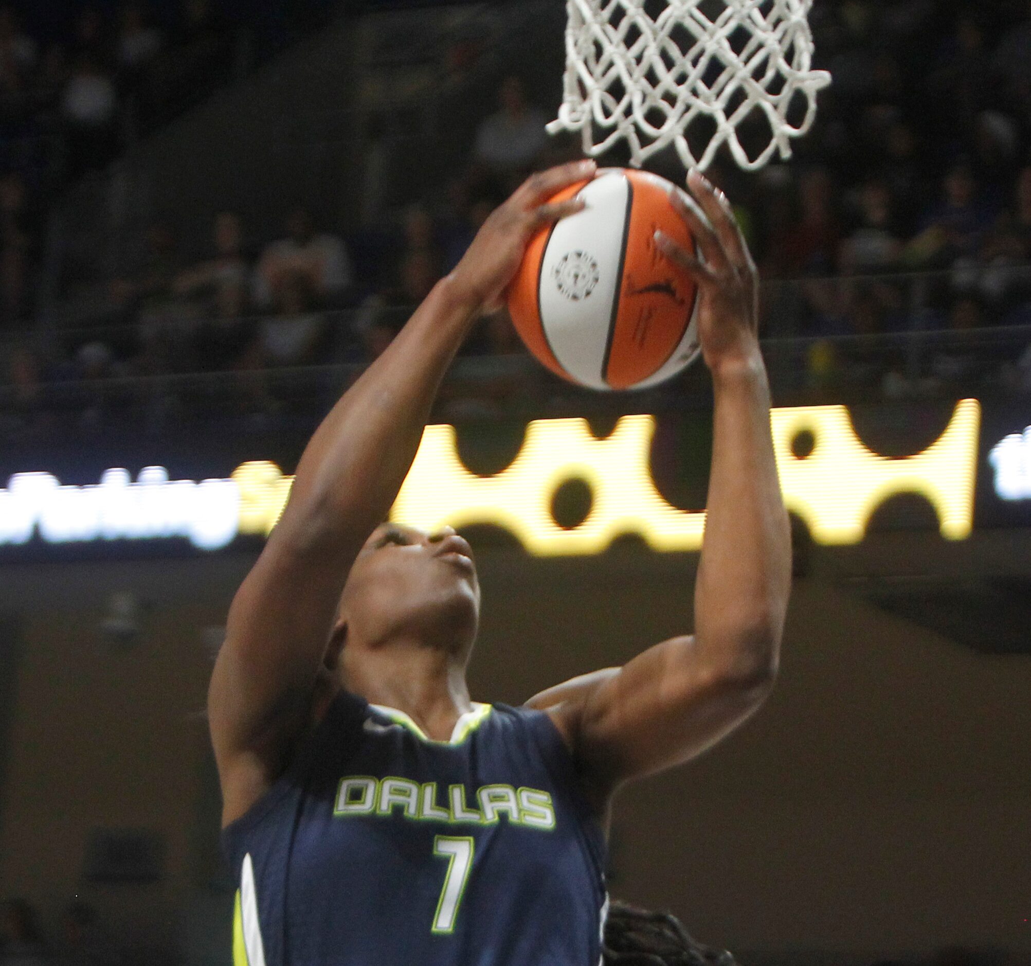 Dallas Wings center Teaira McCown (7) pulls down a tall pass before scoring on the play...