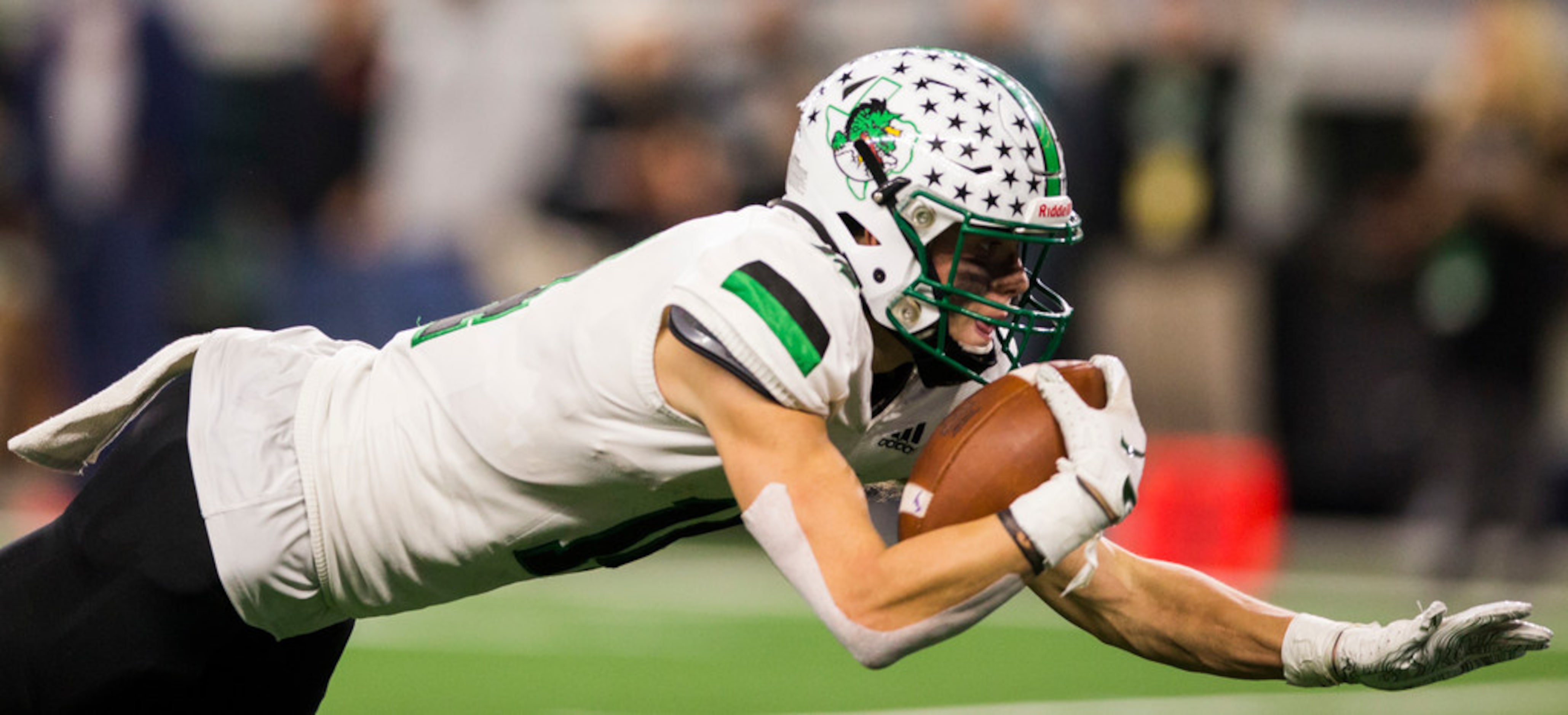 Southlake Carroll running back Owen Allen (4) dives toward the end zone for a touchdown...