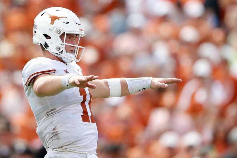 Texas Longhorns quarterback Sam Ehlinger (11) before the snap during the second half of play...