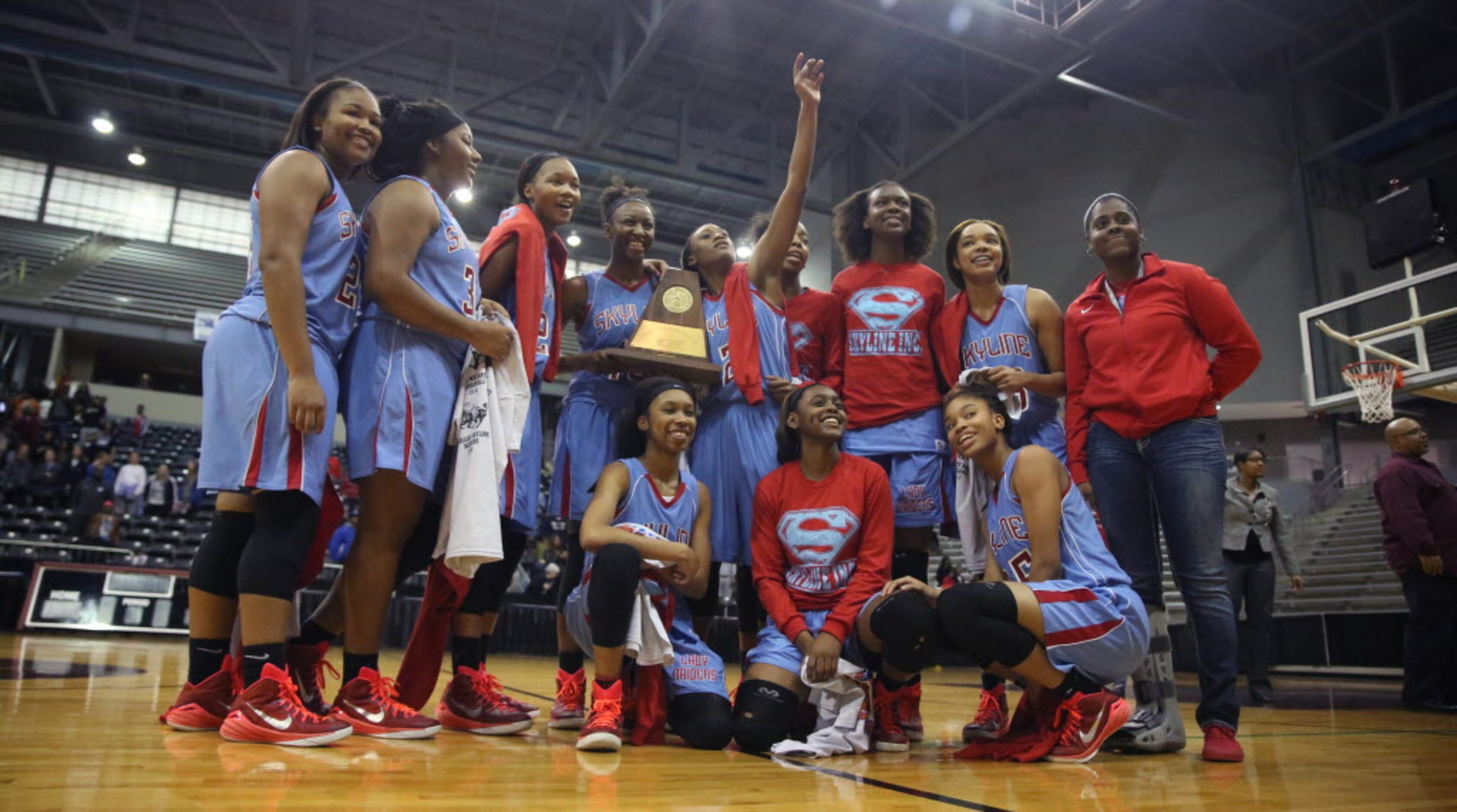 The Dallas Skyline Lady Raiders pose for a portrait after winning the region II AAAAAA...