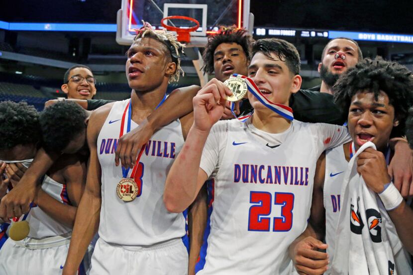 FILE - Duncanville players celebrate their 69-73 win against Klein Forest in last season's...