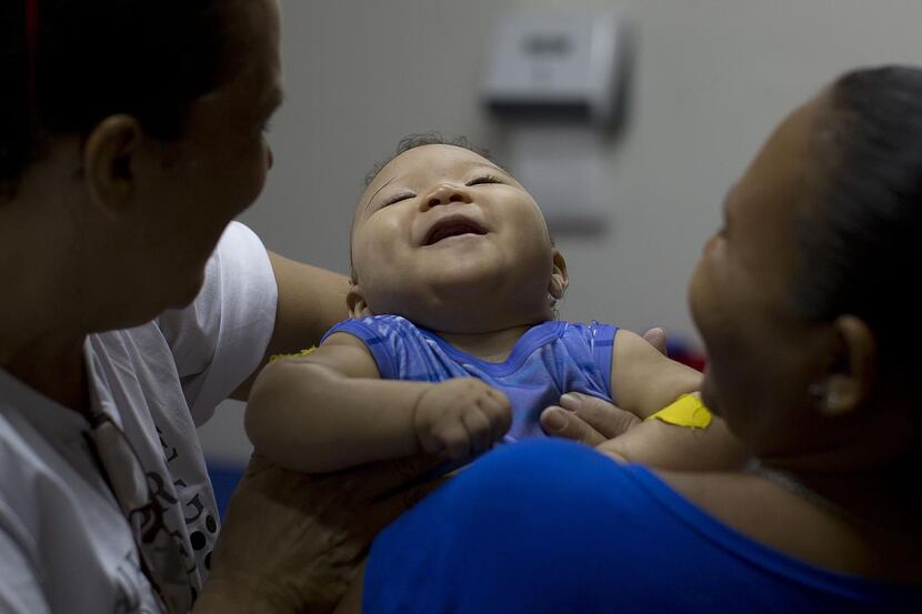 
Caio Julio Vasconcelos who was born with microcephaly, undergoes physical therapy at the...