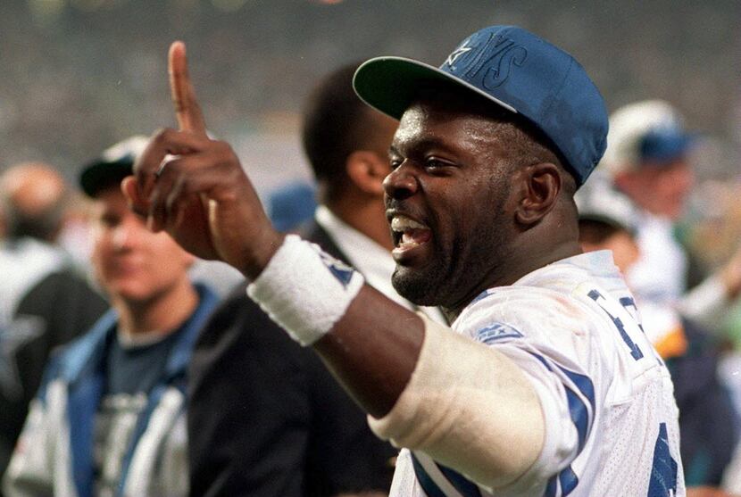 30 JAN 1994:  RUNNING BACK EMMITT SMITH OF THE DALLAS COWBOYS FLASHES THE NUMBER ONE SIGN...