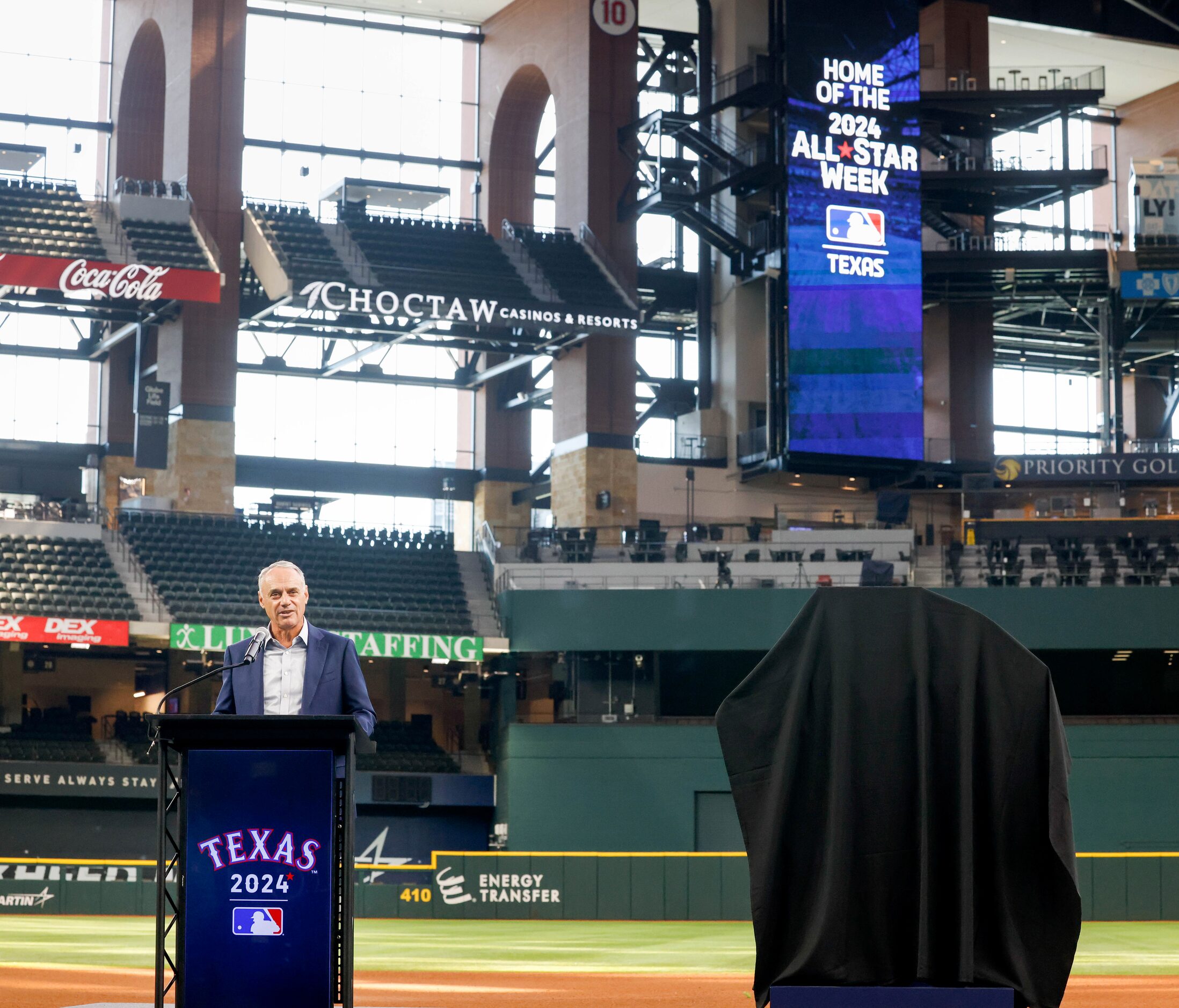 MLB commissioner Rob Manfred speaks to those gathered for the unveiling of the official logo...