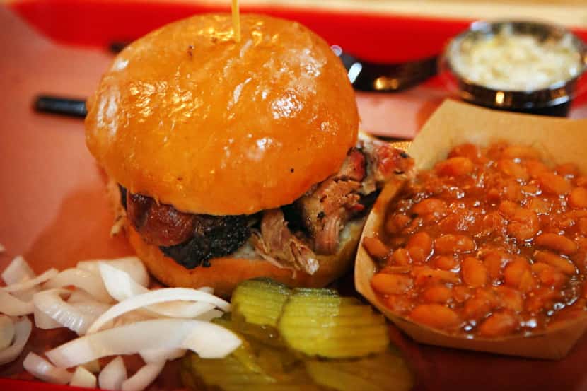 The ToddFather sandwich is stacked with brisket, pulled pork and a hotlink. Owners Todd and...