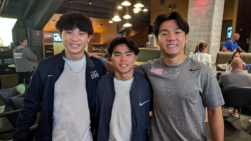 Asher Hong (middle) poses with his brothers Xander Hong (left) and Kiefer Hong (right), who...