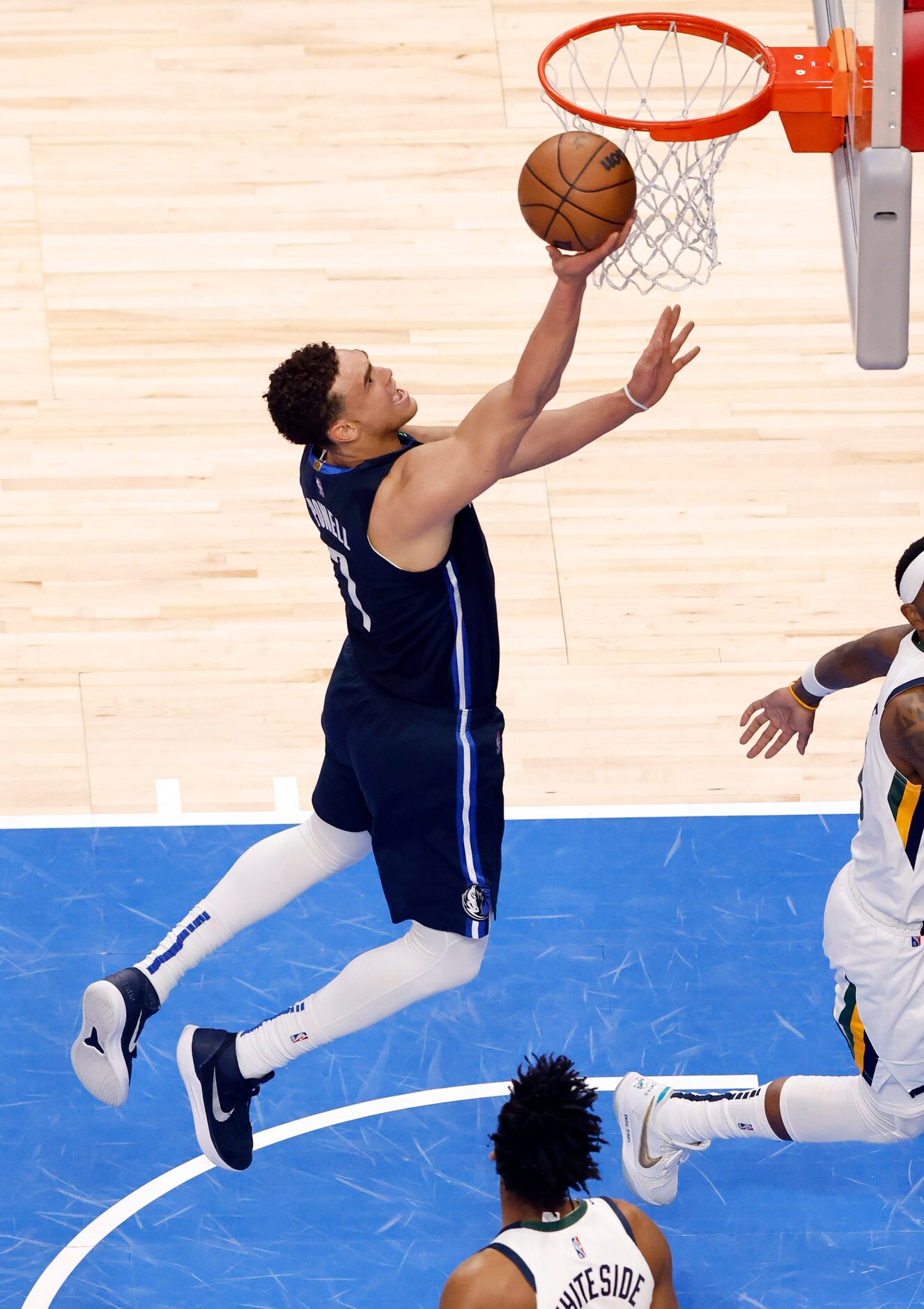 Dallas Mavericks center Dwight Powell (7) lays up a shot against the Utah Jazz during the...