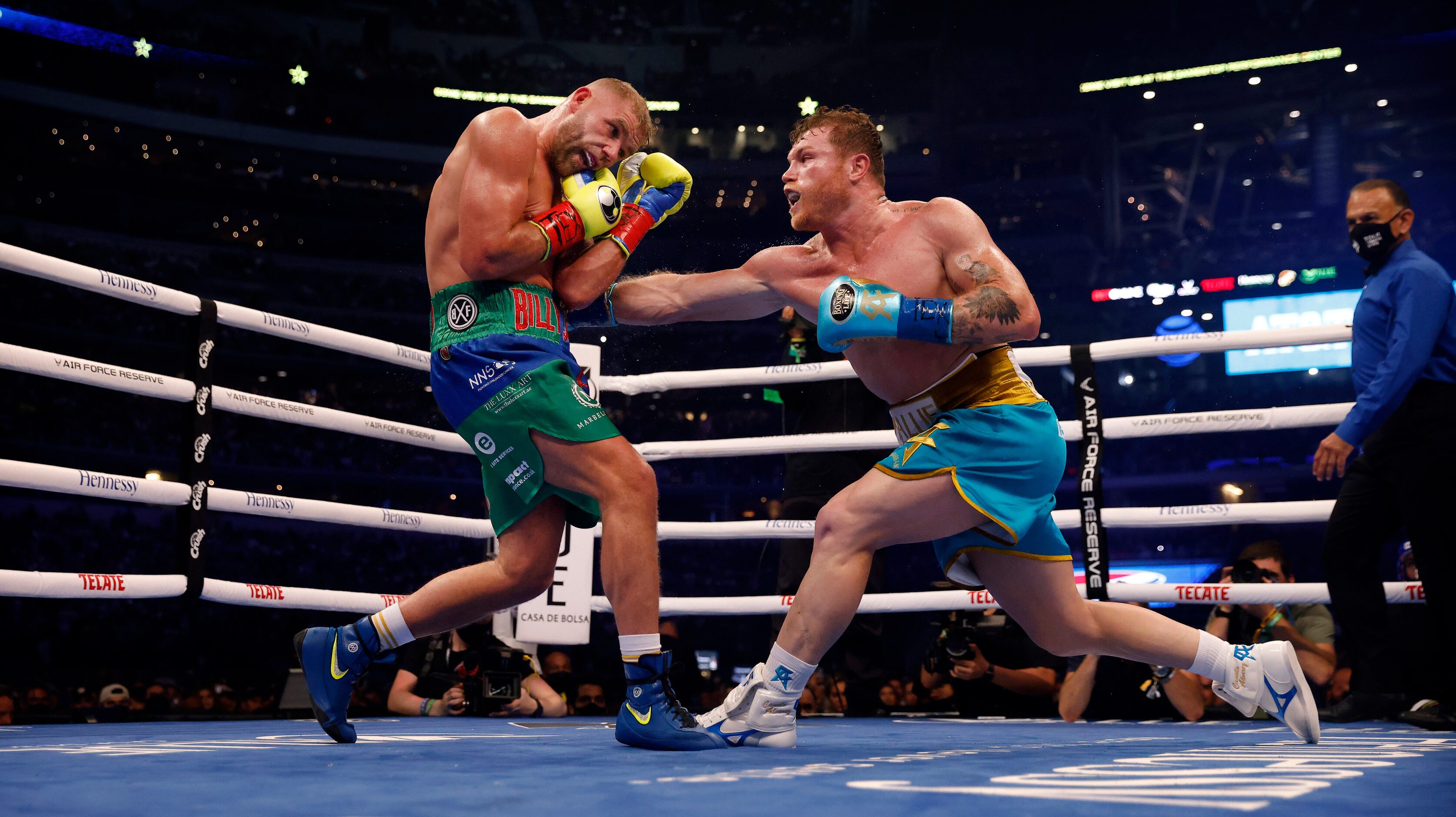 Boxer Canelo Alvarez (right) lands a punch on Billy Joe Saunders during their super...