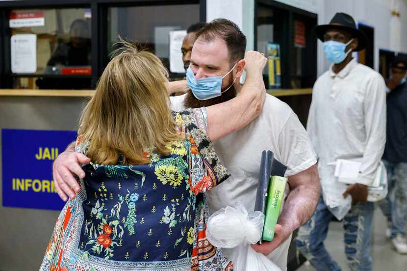 Sheila Williamson (left) runs to hug her son Chad Williamson for the first time in nearly...