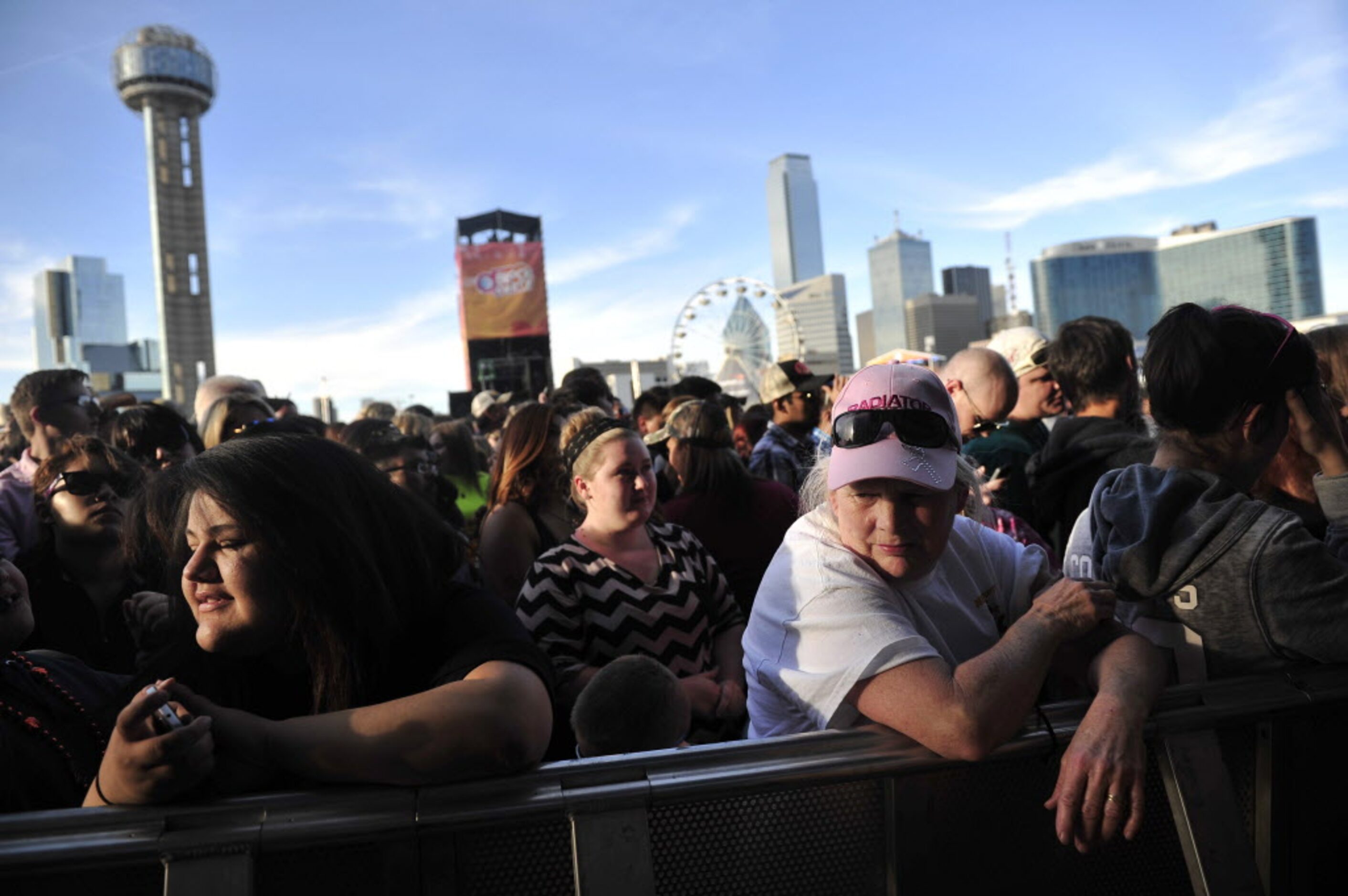 Debra Galloway (right with pink hat) waits in the crowd before listening to Eli Young at the...