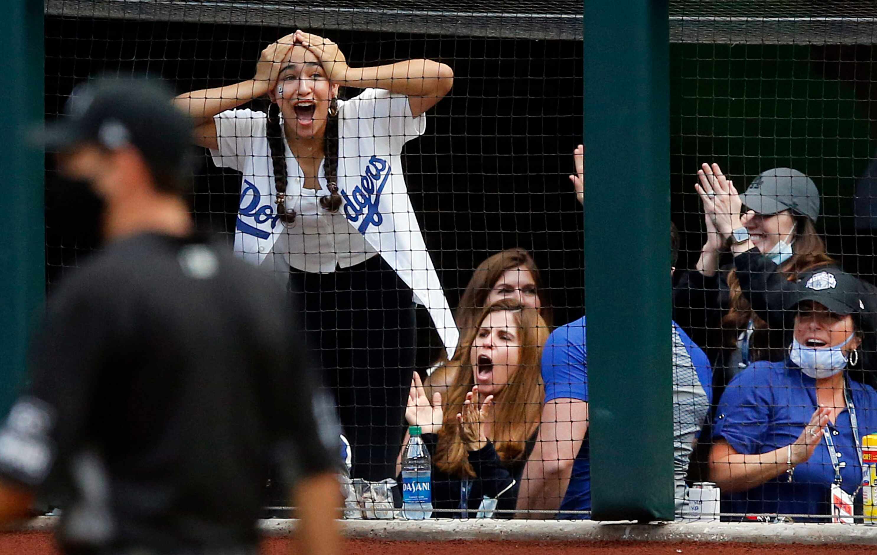 Emmerson Roberts, daughter of Los Angeles Dodgers manager Dave Roberts reacts to right...