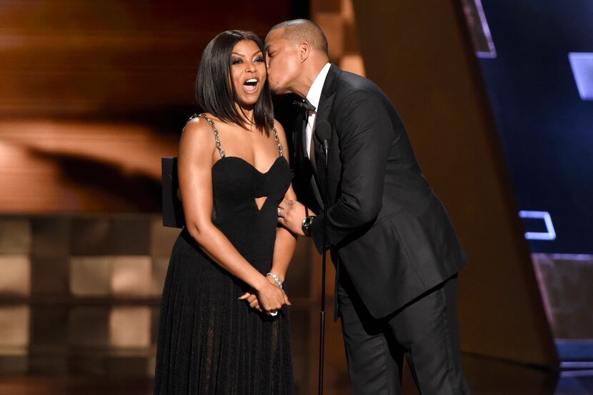 Taraji P. Henson, left, receives a kiss from Terrence Howard. Cookie managed to loom over...