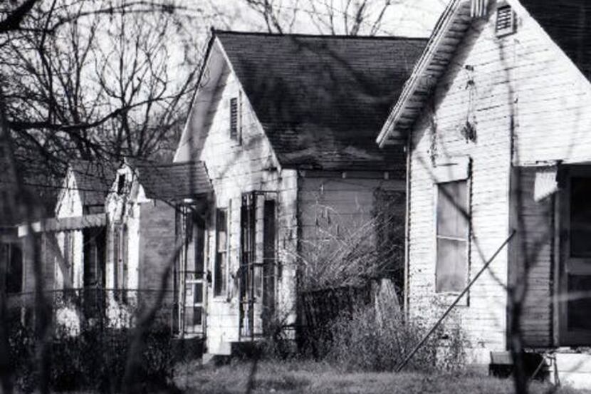 Dec. 19, 1992: A line of damaged houses scheduled for demolition in the Rochester Park...