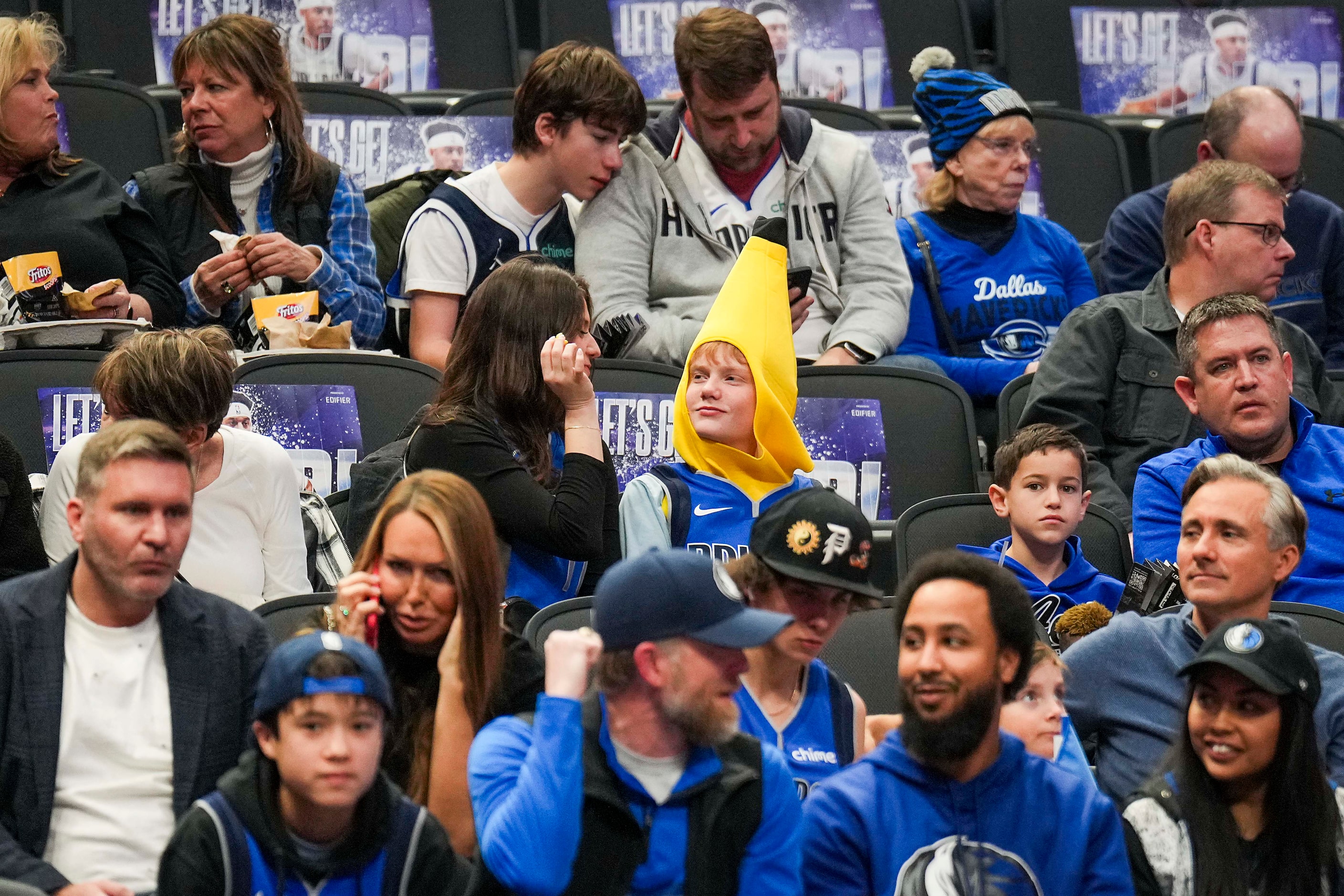 A fan wears a banana costume before an NBA basketball game between the Dallas Mavericks and...