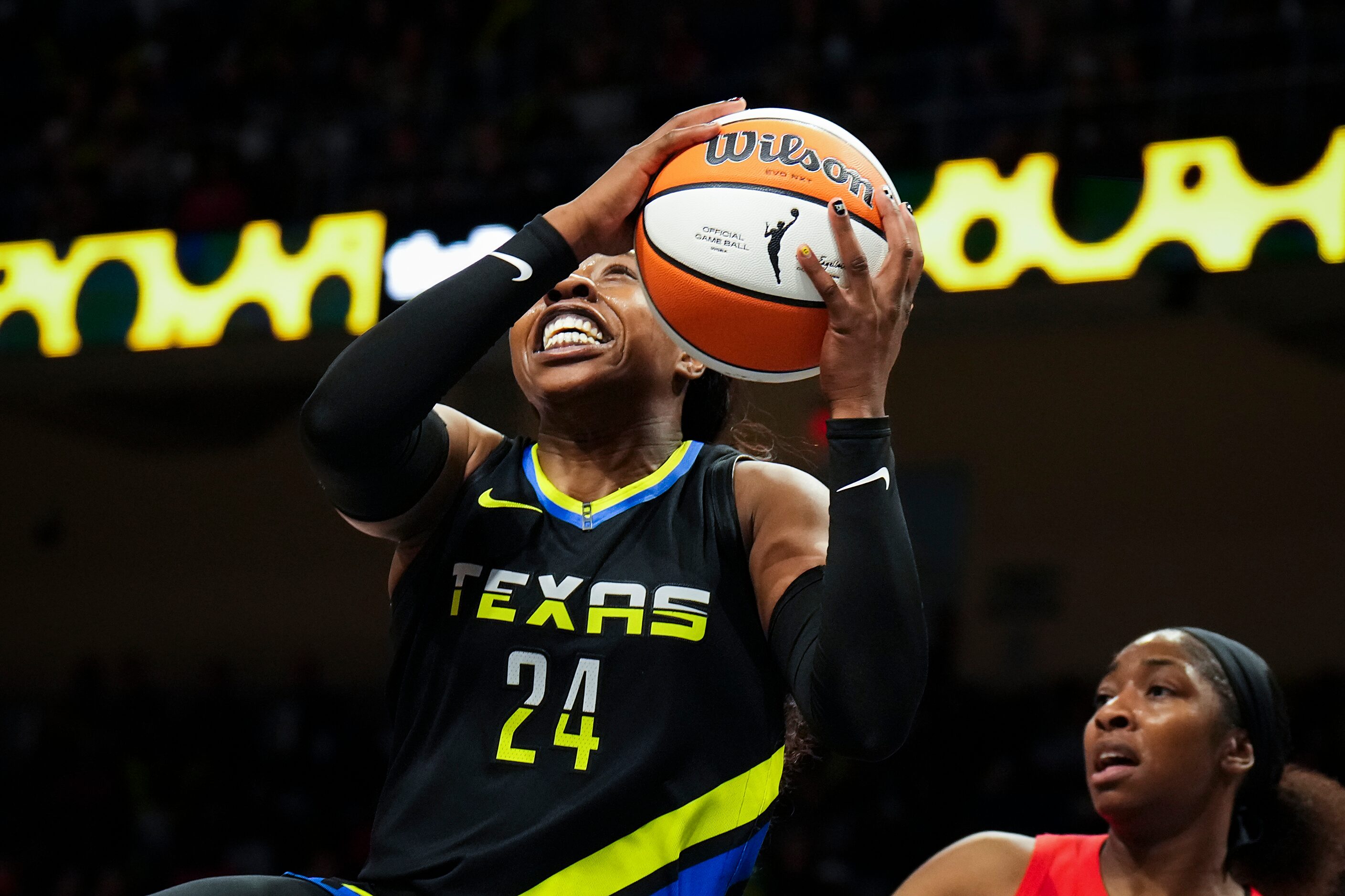 Dallas Wings guard Arike Ogunbowale (24) drives the the basket past Atlanta Dream guard Aari...