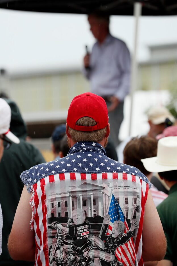 Trump supporter Scott Tilton of Des Moines listened to Republican presidential candidate and...