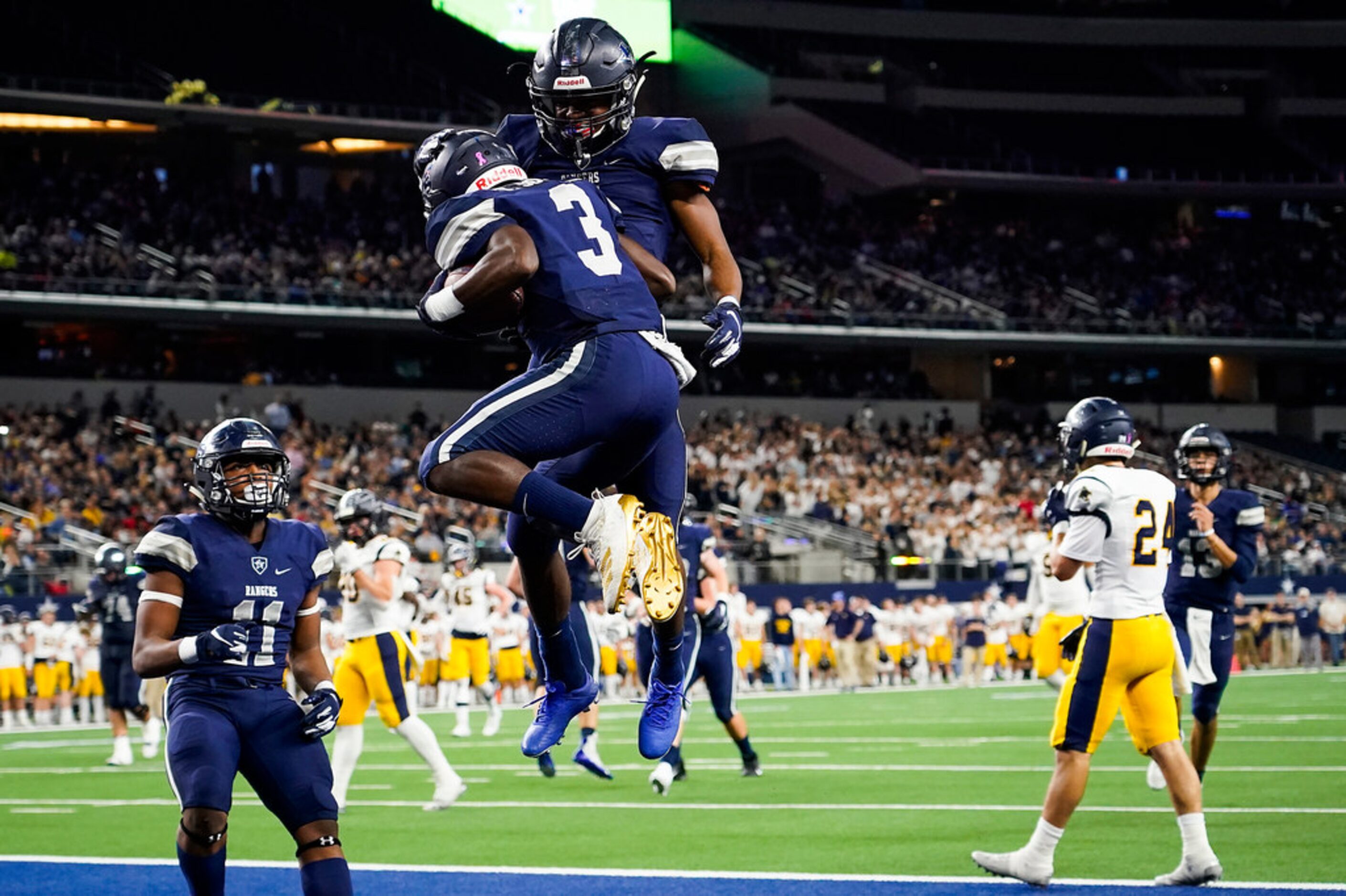 Frisco Lone Star wide receiver Tolu Sokoya (3) celebrates with running back Jaden Nixon...